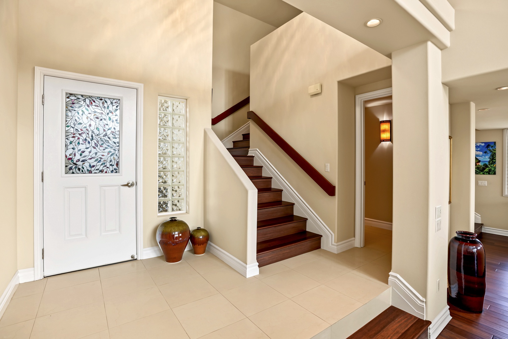 Princeville Vacation Rentals, Hale Hau'oli Moku - Come home through a glass-paneled front door to a tiled entry and the stairs just inside.