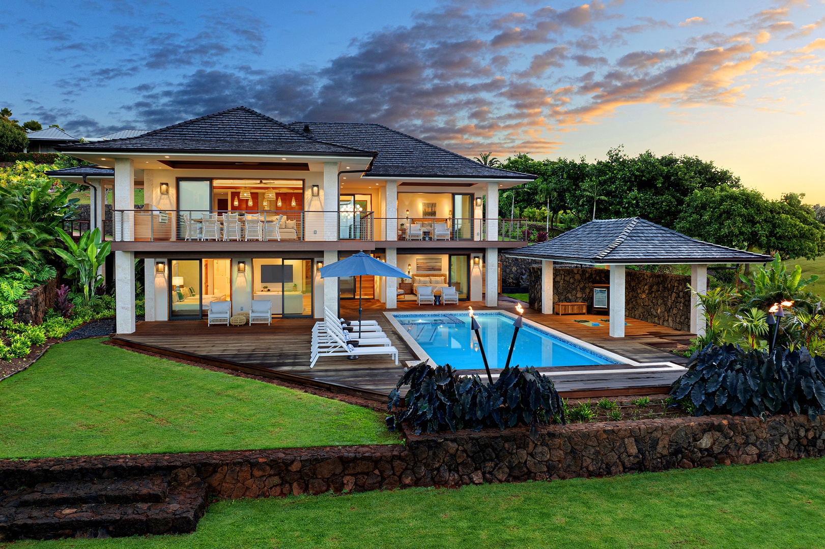 Koloa Vacation Rentals, Hale Kai‘opua at Kukui'ula - Stunning aerial view showcasing the estate's elegant design and pool.