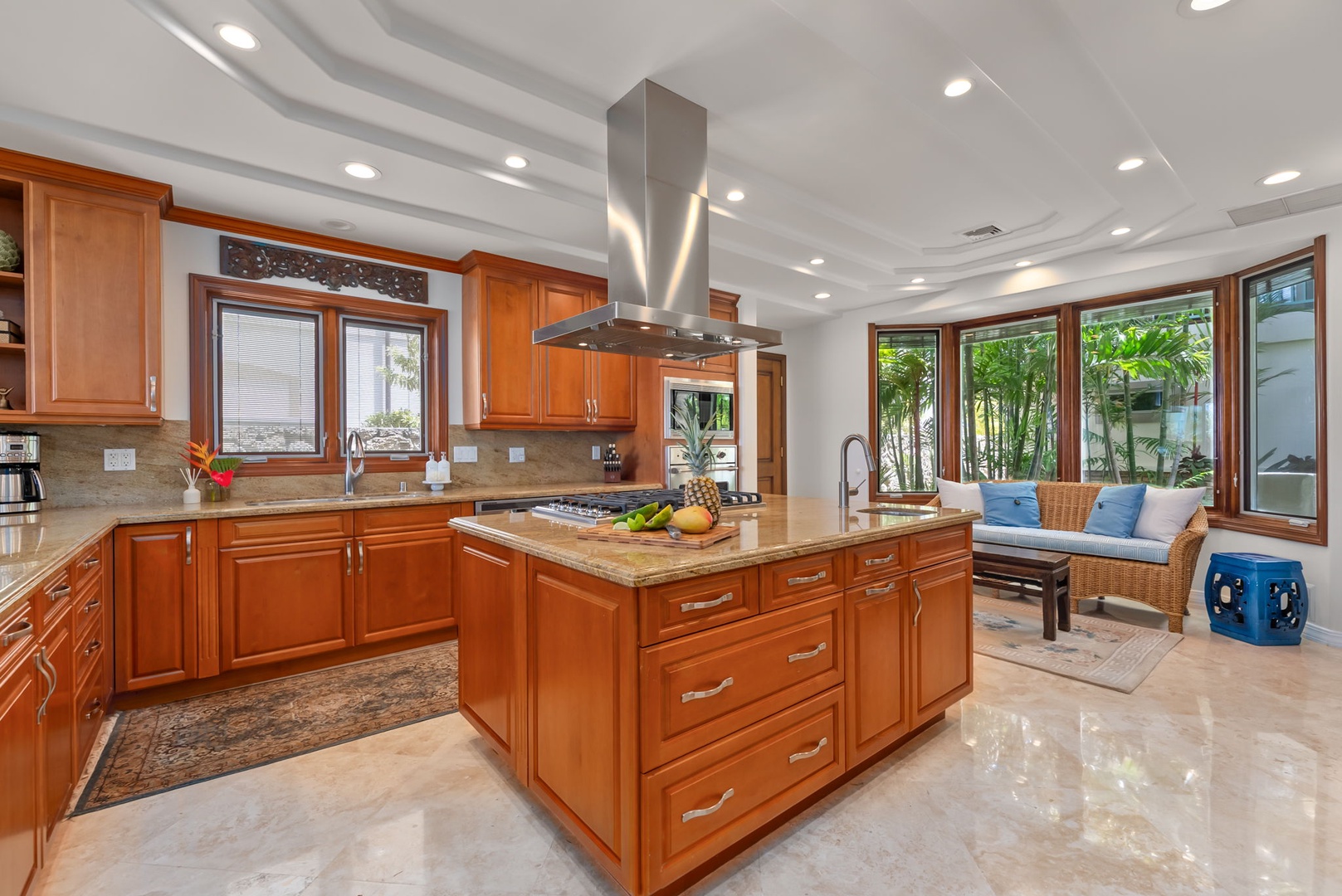 Honolulu Vacation Rentals, Maunalua Estate - The chef's kitchen pairs generous prep space with tropical views and seamless indoor comfort.