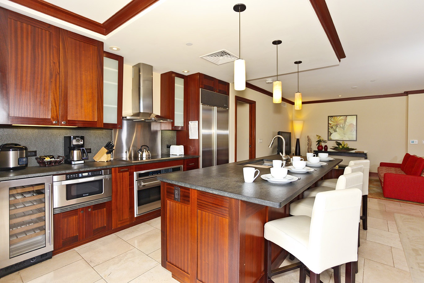 Kapolei Vacation Rentals, Ko Olina Beach Villas B204 - A Roy Yamaguci designed full Kitchen with stainless steel appliances and pendant lights.