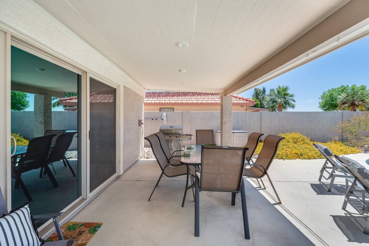Glendale Vacation Rentals, Cahill Casa - Enjoy the fresh Arizona air under the backyard patio which covers a large outdoor dining table fit for 6 guests, as well as a barbecue grill station, perfect for cookout nights with the whole family.