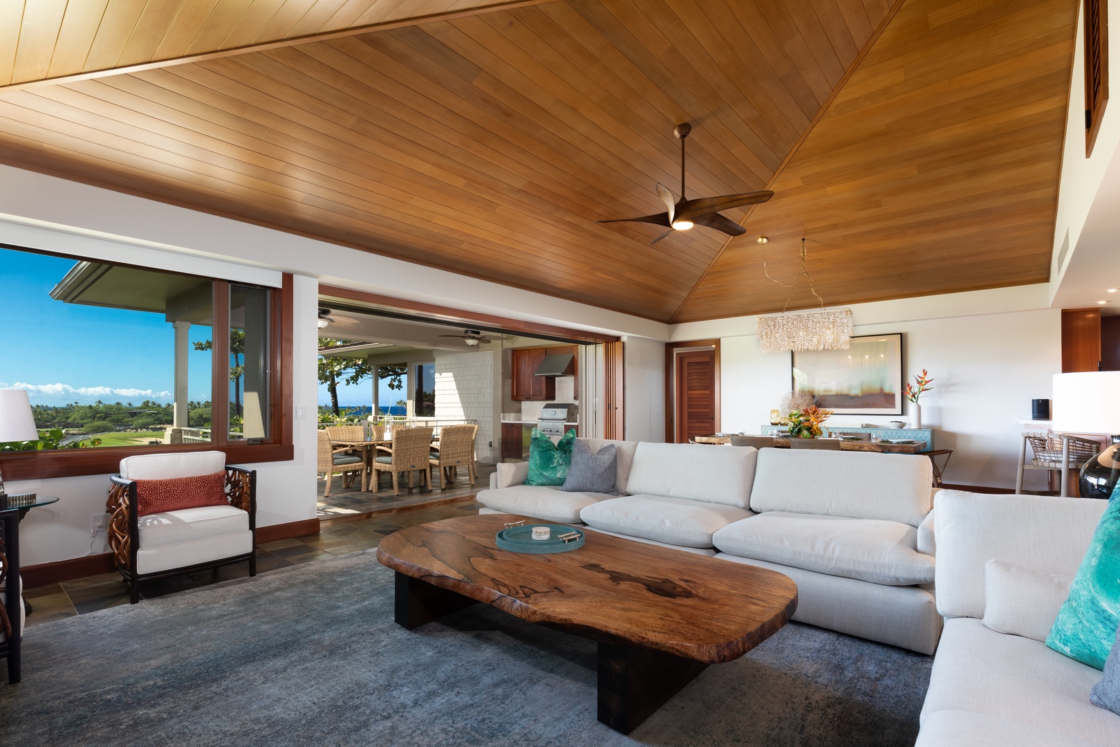 Kailua Kona Vacation Rentals, 3BD Waiulu Villa (111D) at Hualalai Resort - Warm and inviting living space with high ceilings, wooden beams, and natural tones.