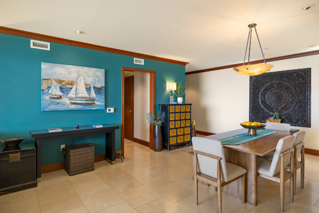 Kapolei Vacation Rentals, Ko Olina Beach Villas B109 - Chic and vibrant dining space complemented by unique artwork, ideal for enjoyable dining experiences.