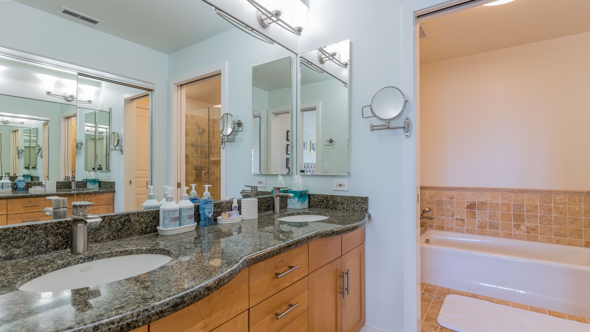 Kapolei Vacation Rentals, Kai Lani 21C - The primary guest bathroom features a double vanity and ample lighting.