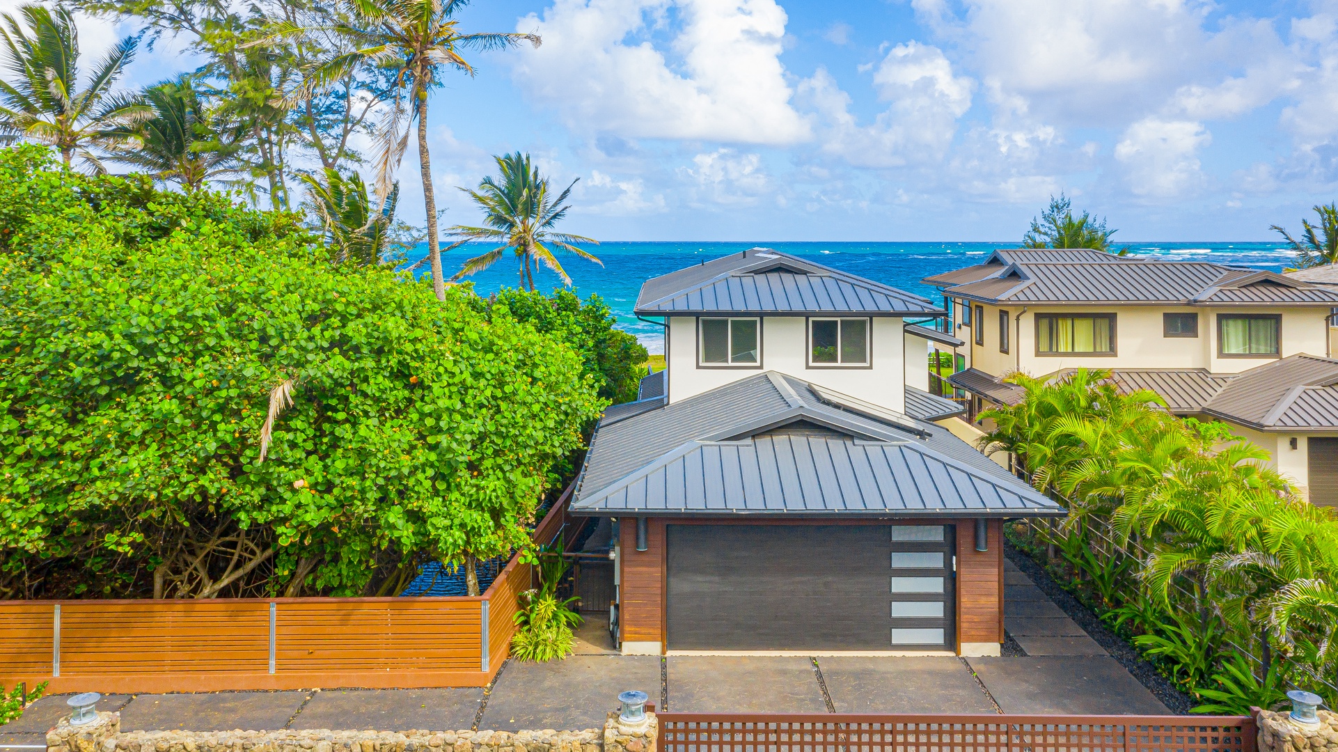 Laie Vacation Rentals, Majestic Mahakea Oceanfront Oasis - Charming coastal home with modern architecture and a private garden space.