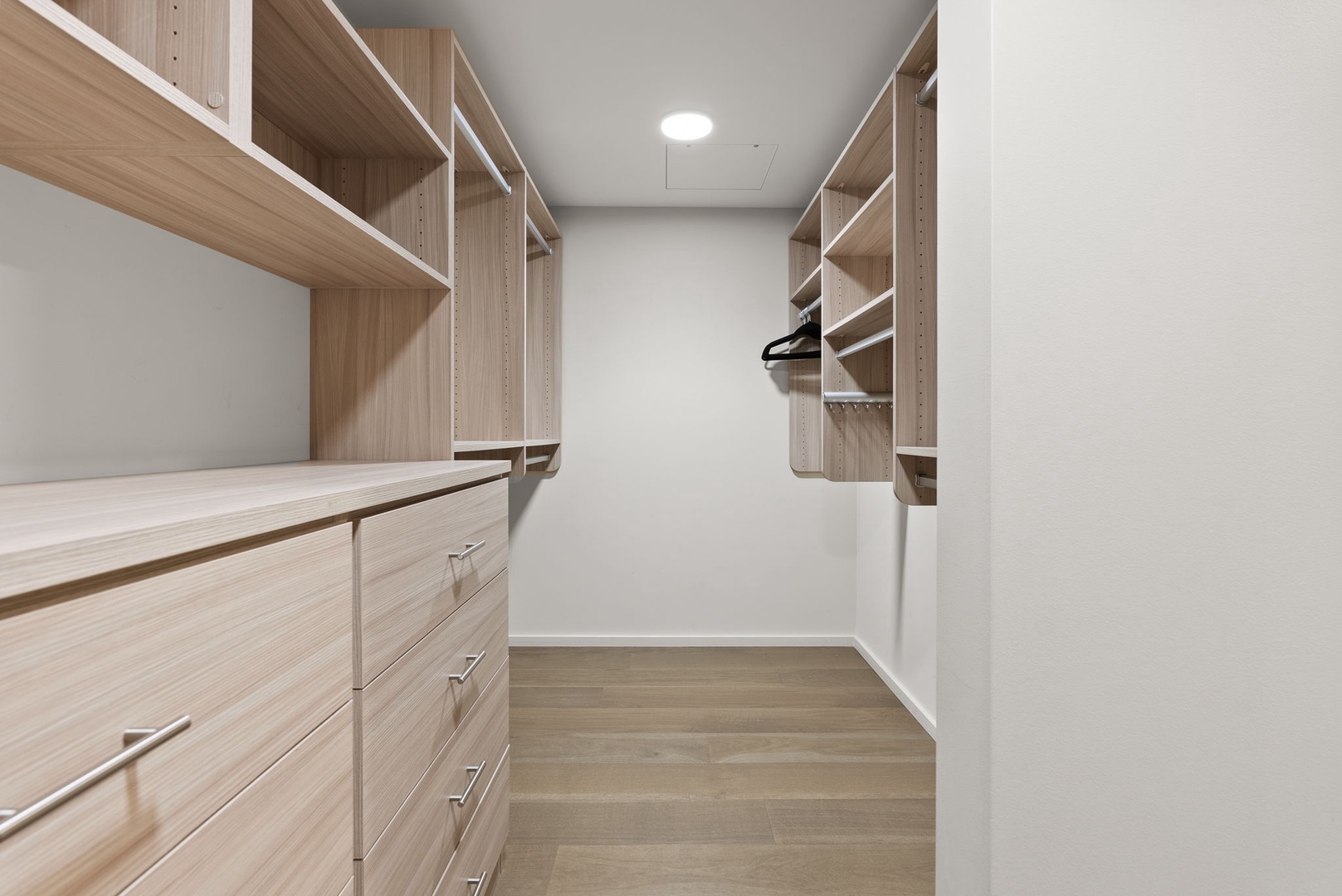 Honolulu Vacation Rentals, Park Lane Getaway - Another view of the walk-in closet, featuring built-in shelves and hanging space for all your belongings.