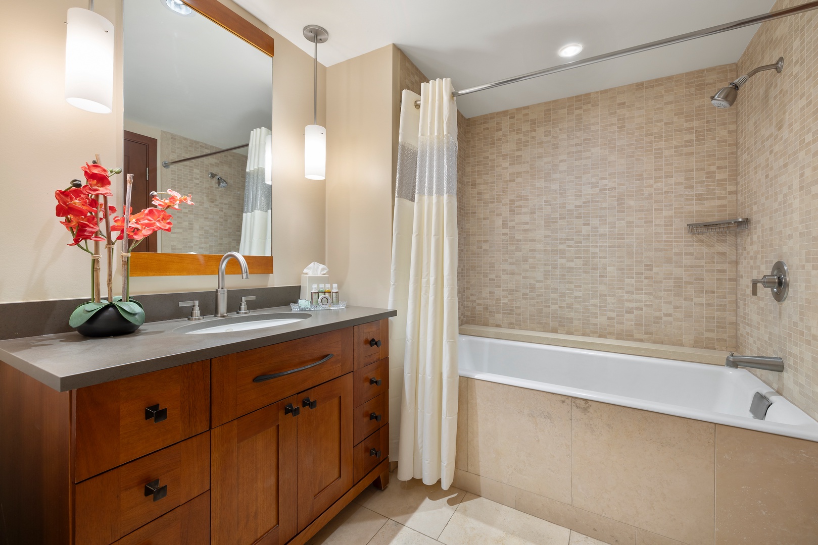 Kapolei Vacation Rentals, Ko Olina Beach Villas B107 - Elegant third guest bathroom with a warm ambiance and modern amenities.