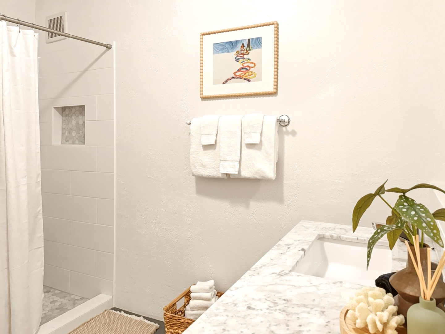 Honolulu Vacation Rentals, Ho'okipa Villa - Refresh in your bright, spa-like bathroom with marble counters and modern shower.