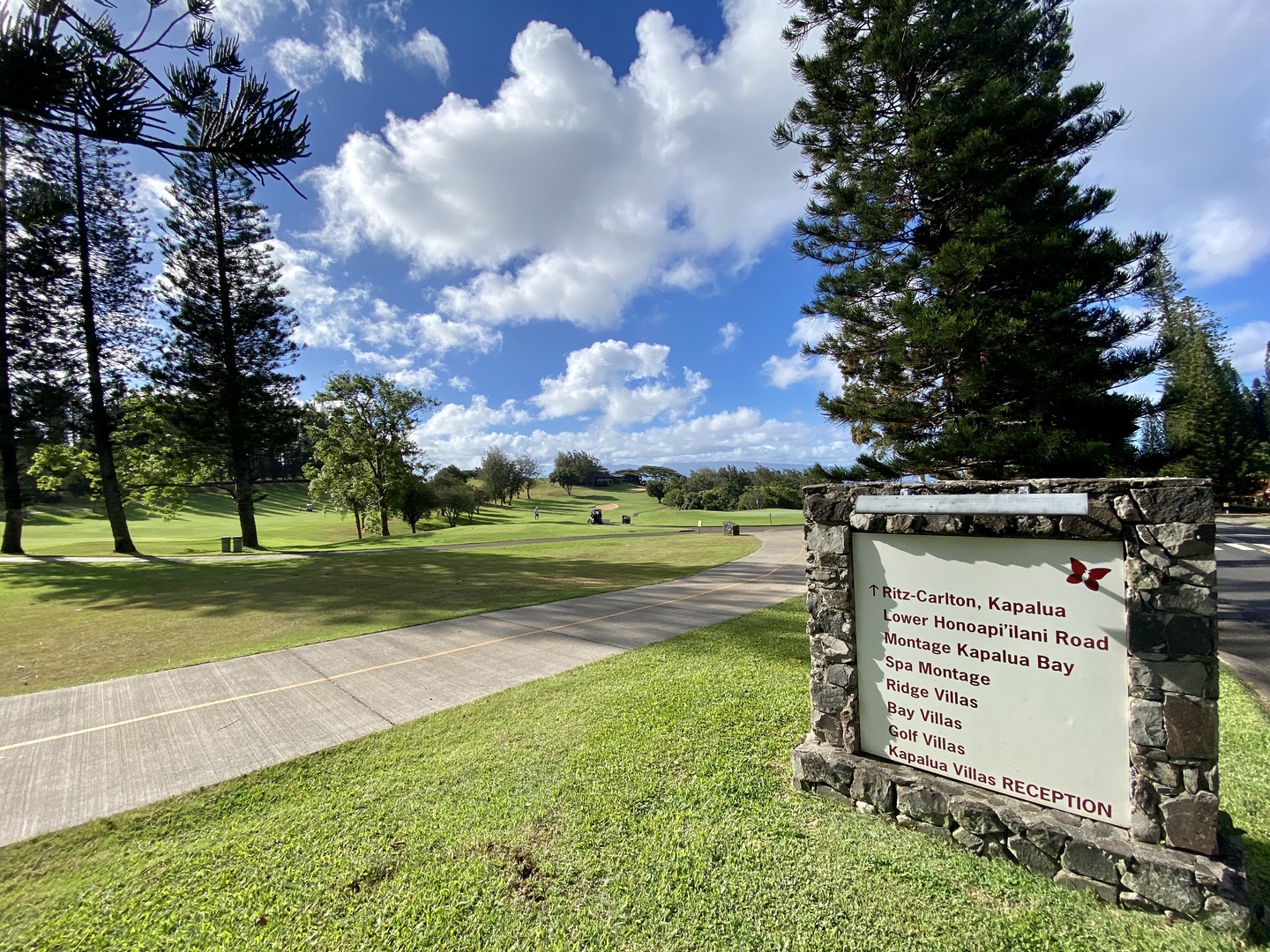 Lahaina Vacation Rentals, Kapalua Ridge 1622 - Inviting entry to expansive golf courses offering lush views and a serene escape into nature.