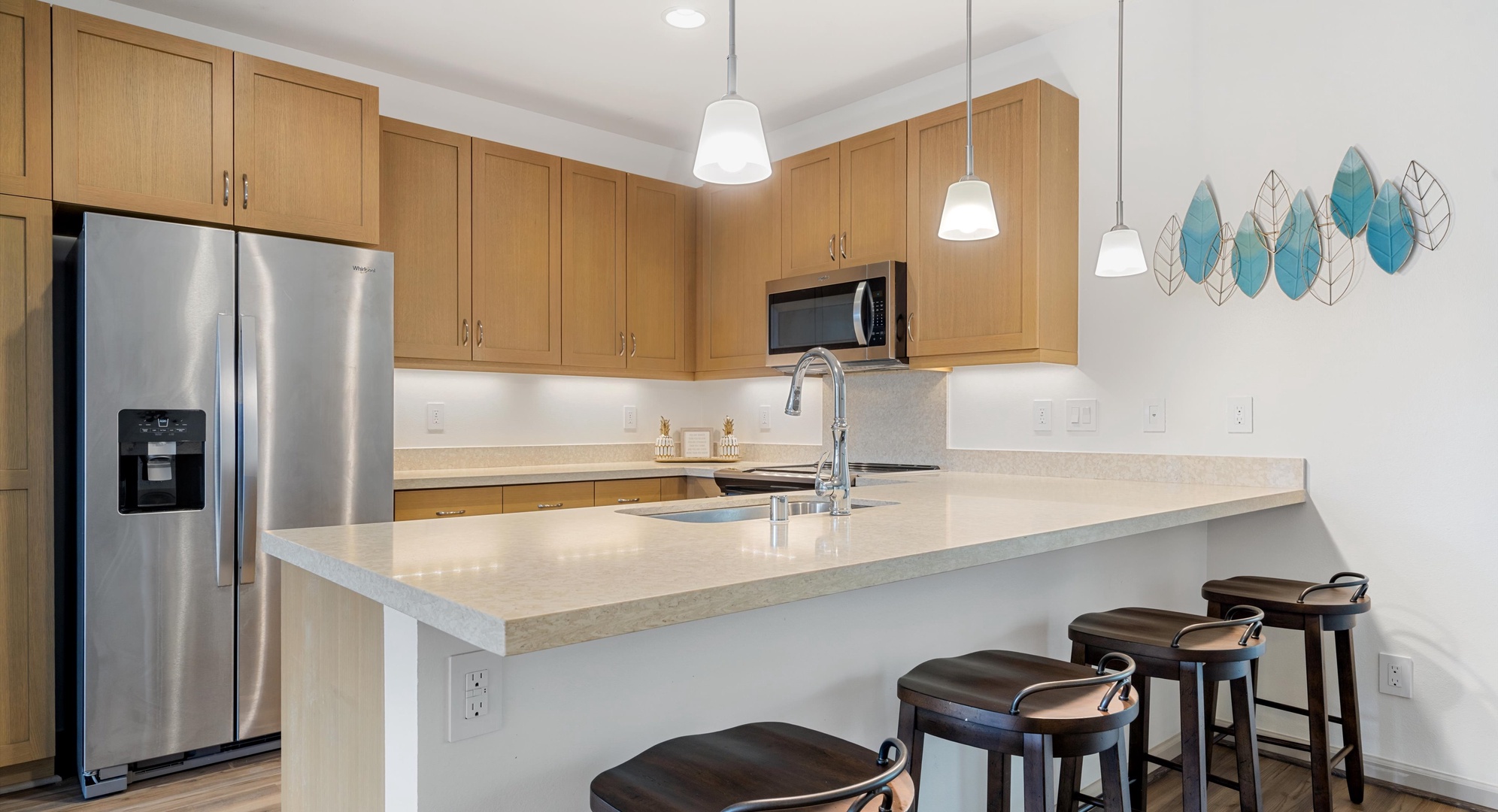 Makaha Valley Vacation Rentals, Makaha Valley Hale Kai** - Breakfast bar with seating, ideal for coffee or casual dining.
