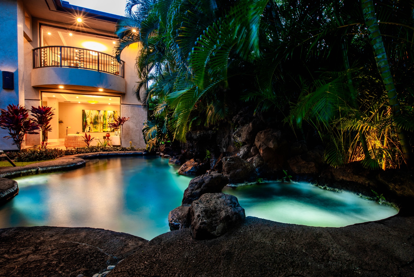Honolulu Vacation Rentals, Pili Pono - Tropical plunge pool surrounded by lush greenery at twilight.