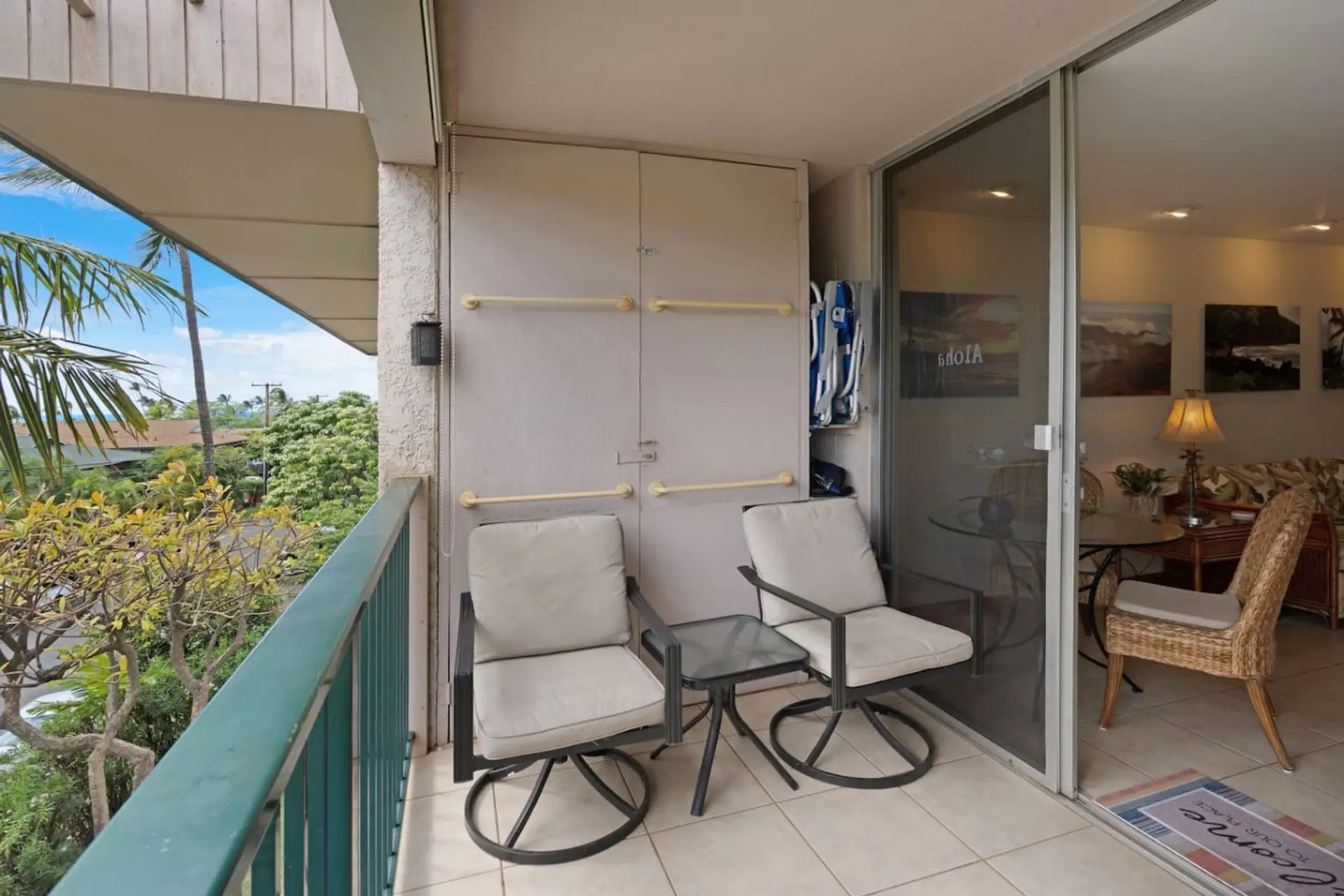 Kihei Vacation Rentals, Kalama Terrace P302 - Settle into a swivel chair on the lanai, a locked storage closet at your back for whatever you don't want inside.