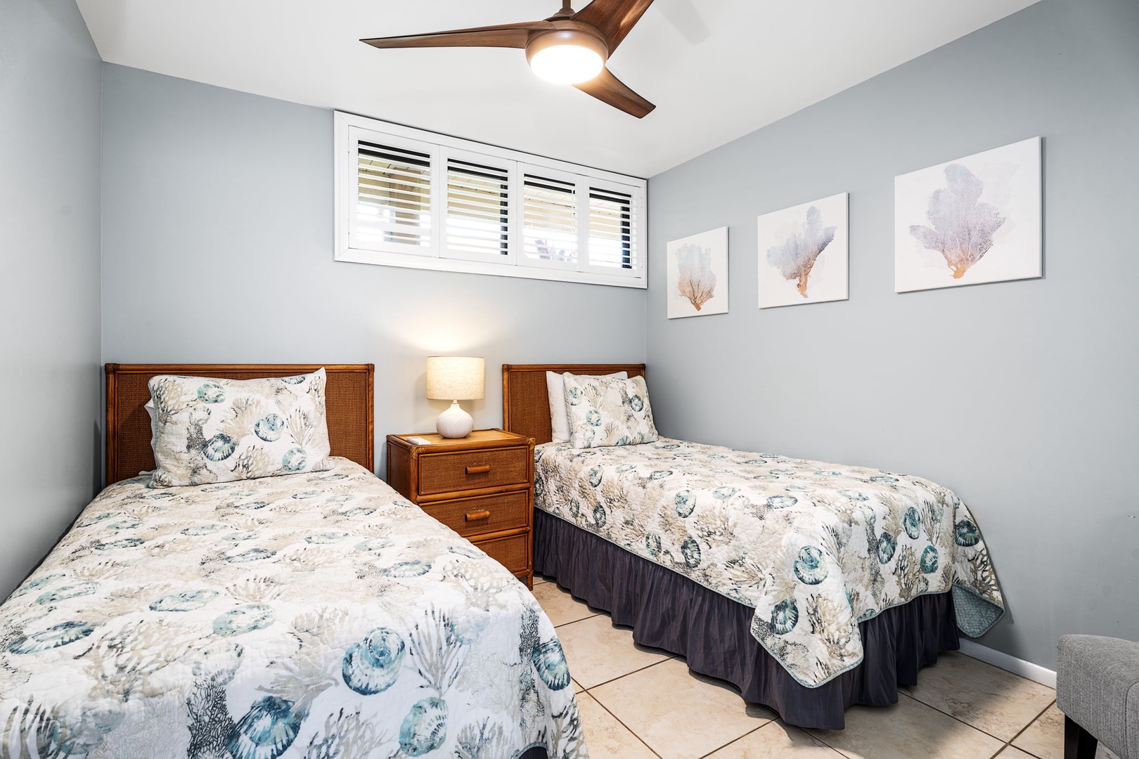 Kailua Kona Vacation Rentals, Sea Village 1105 - Guest bedroom with twin beds, ceiling fan, and A/C—perfect for friends or children.