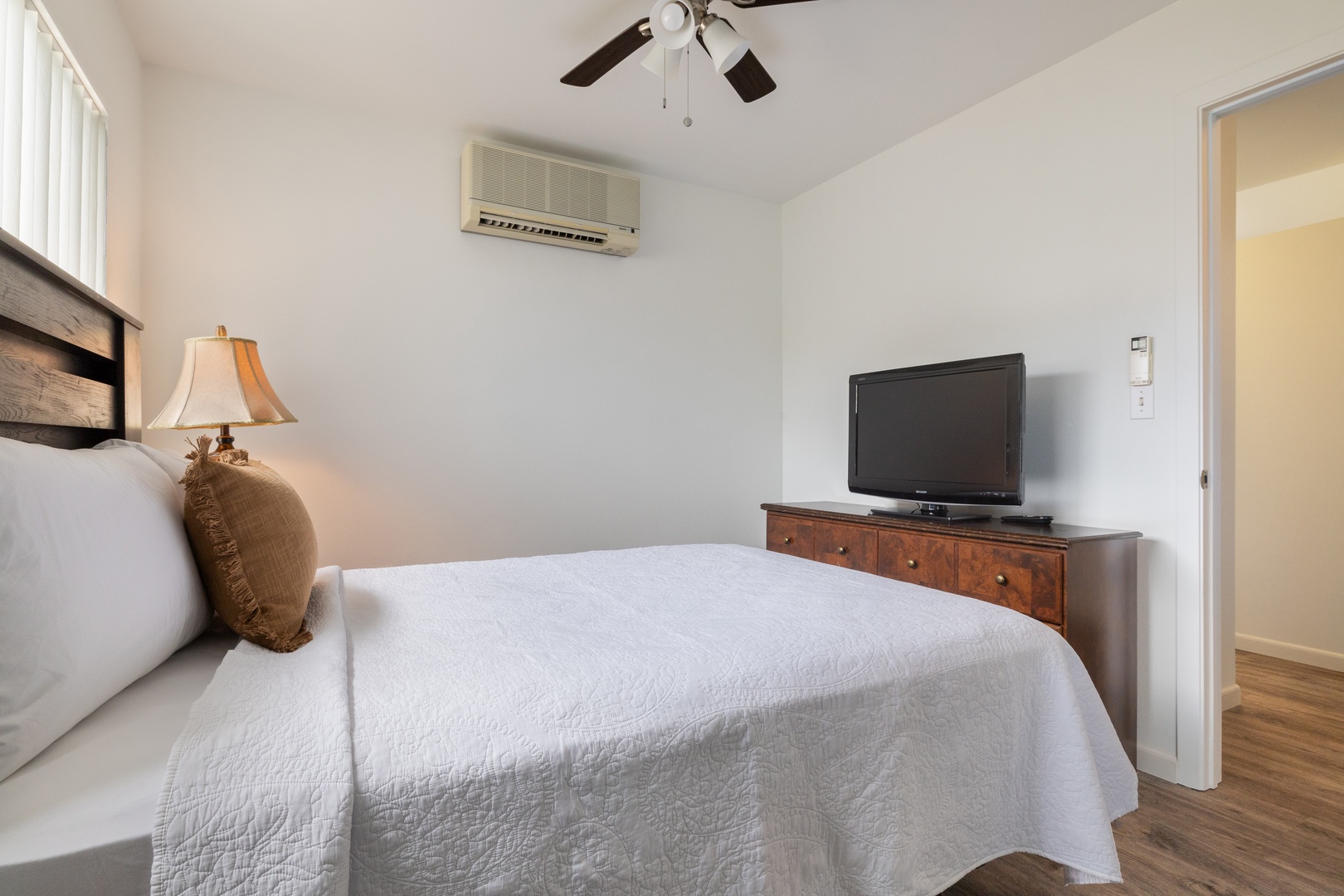 Kapolei Vacation Rentals, Fairways at Ko Olina 7A - Unwind in your peaceful bedroom with crisp linens, gentle ceiling fan breeze, and your own TV for cozy nights in.