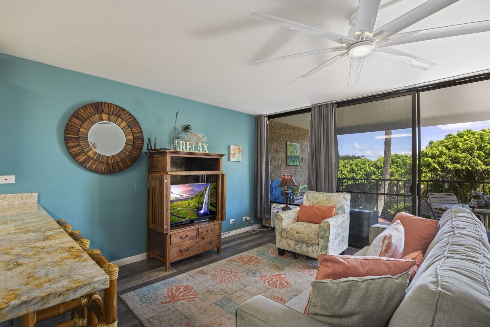Kihei Vacation Rentals, Kihei Alii Kai C206 - Sink into the floral armchair with the green canopy just past the screened doors.