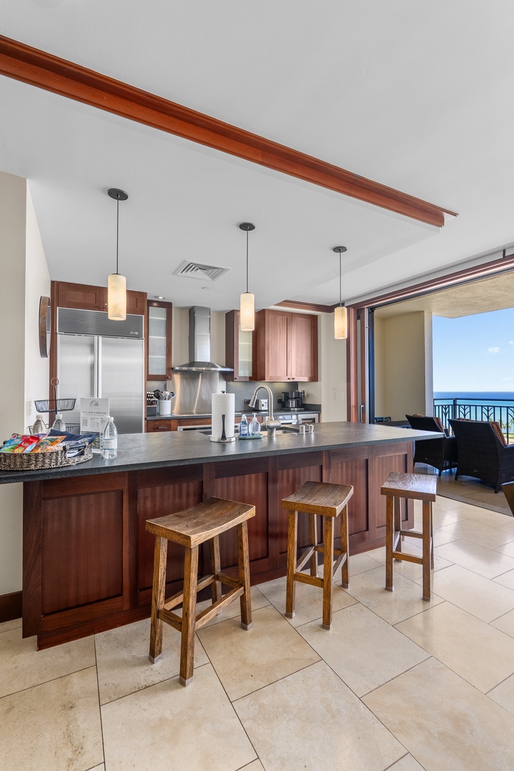 Kapolei Vacation Rentals, Ko Olina Beach Villas O1404 - Claim a stool at the island, ocean in the windows just beyond.