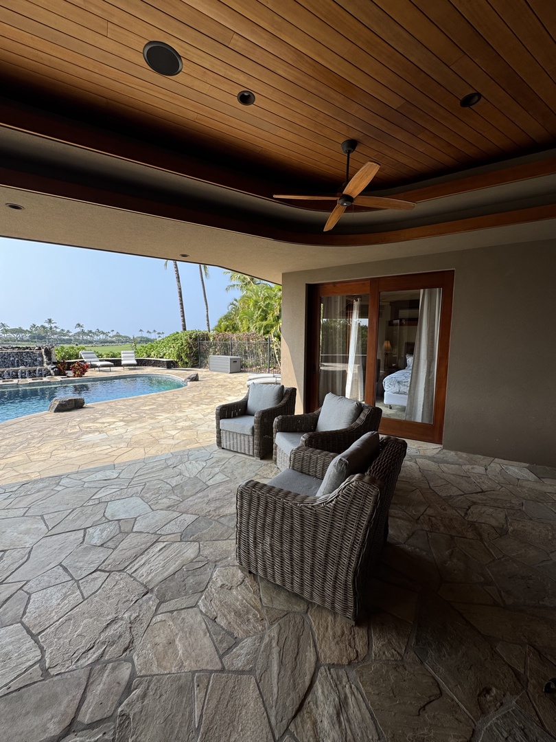 Kamuela Vacation Rentals, Hale Konane - Enjoy shaded comfort in the lanai seating area with poolside views.