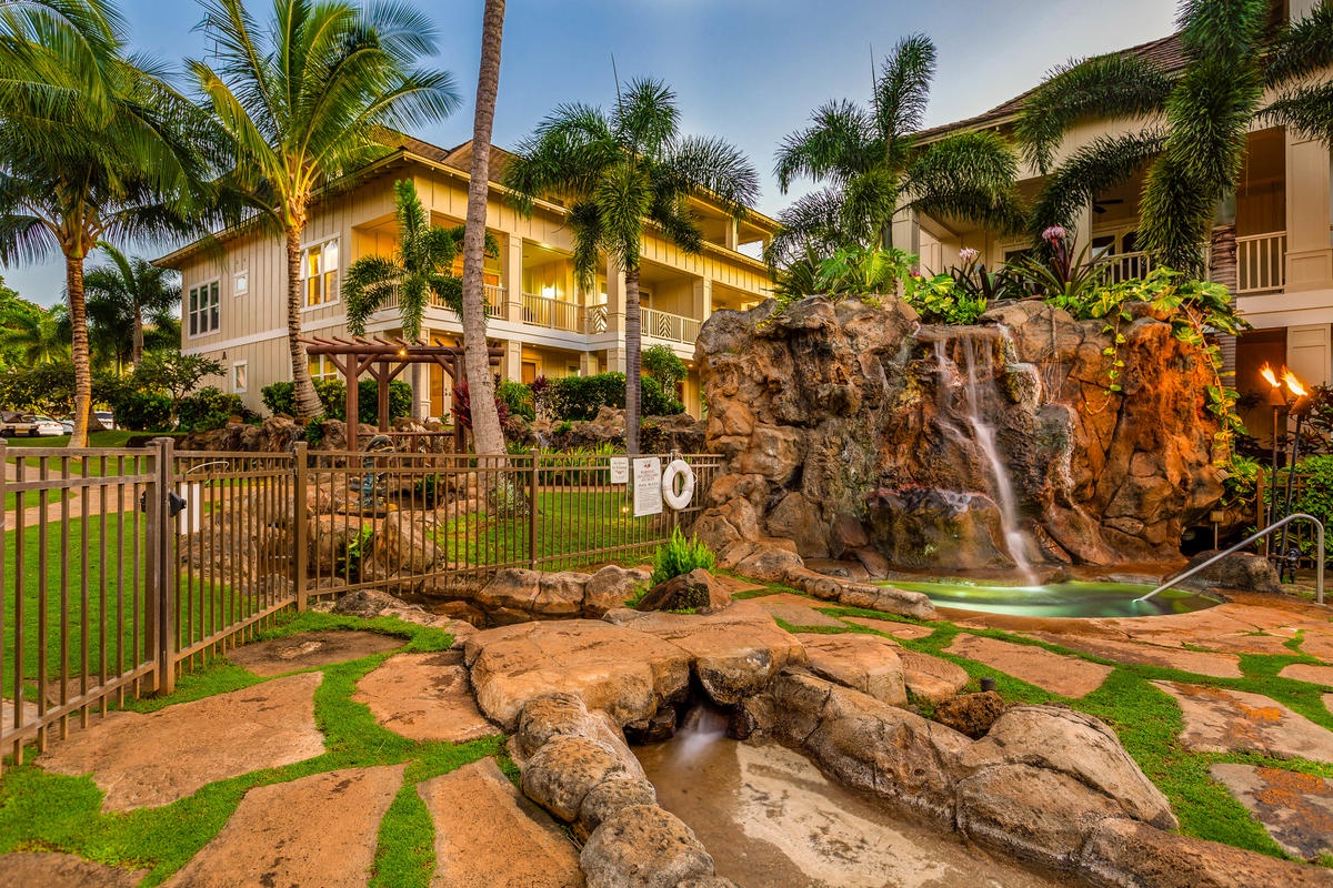 Koloa Vacation Rentals, Villas at Poipu Kai B111 - Relax in the tropical-inspired pool area with cascading waterfalls and lush landscaping.