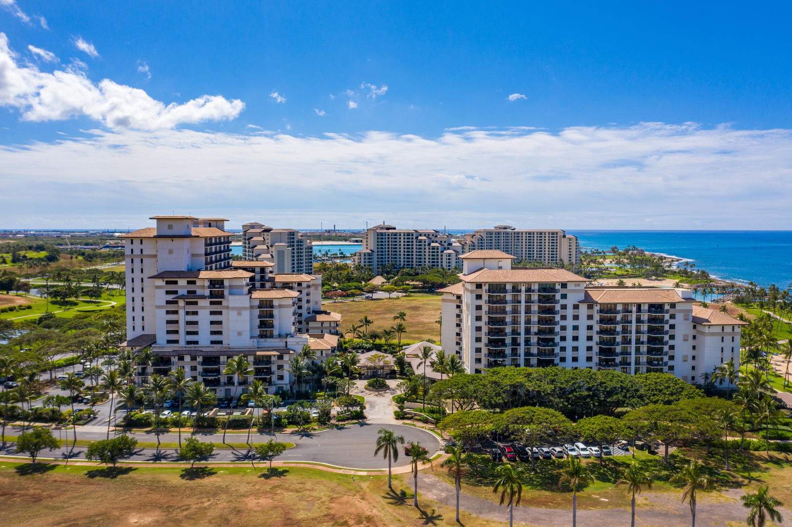 Blue sky, blue water, the resort spread along the coast between them.