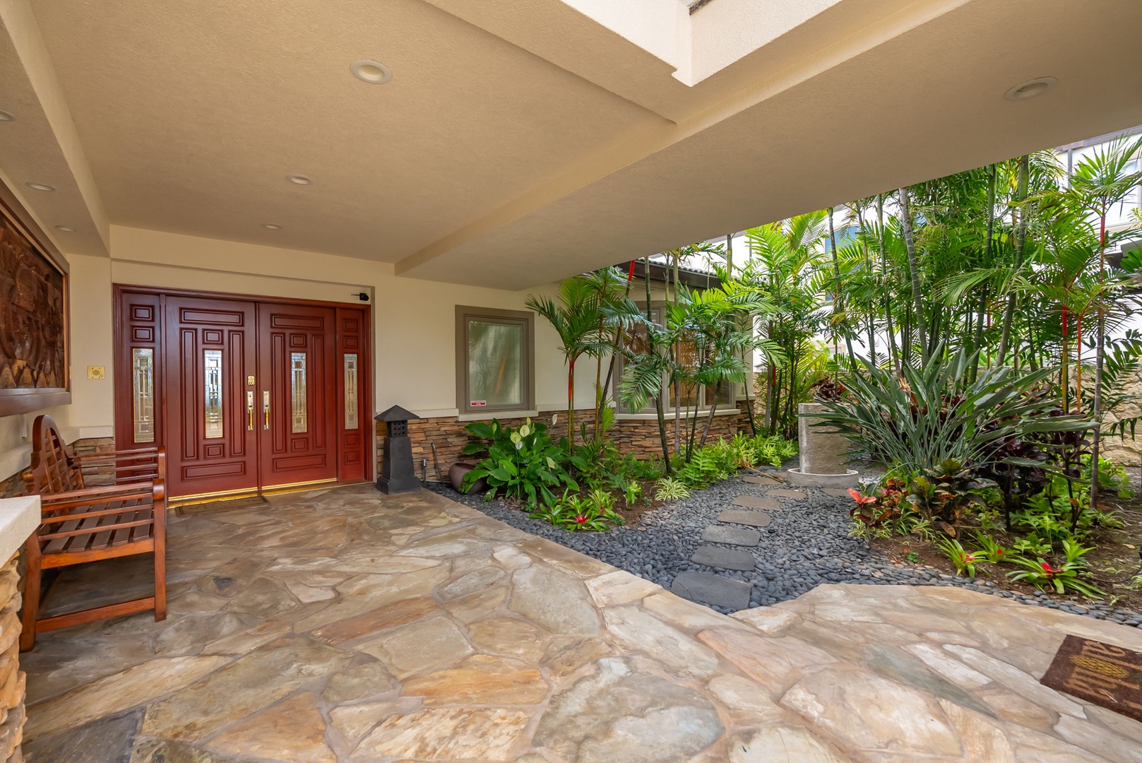 Honolulu Vacation Rentals, Maunalua Estate - A covered entry framed by tropical greenery offers a quiet arrival into your island retreat.