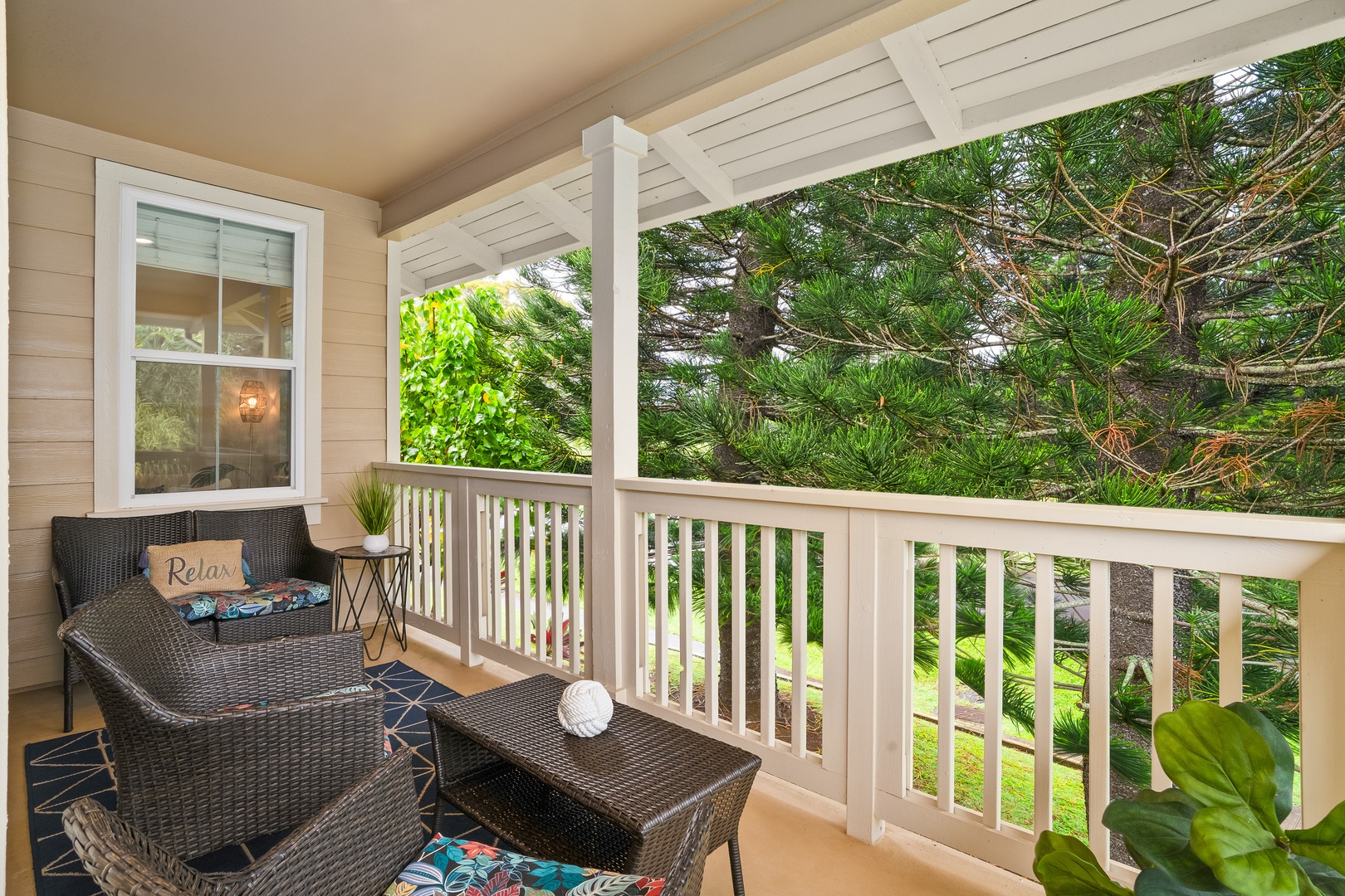 Princeville Vacation Rentals, Hale Kaua'i - Unwind outdoors with lush garden views and a quiet setting for morning coffee.