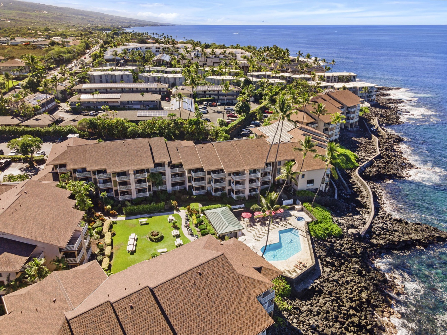 Kailua Kona Vacation Rentals, Sea Village 4213 - Bird’s-eye view of the resort-style pool, hot tub, and BBQ area—all steps from your unit at Sea Village 4213.