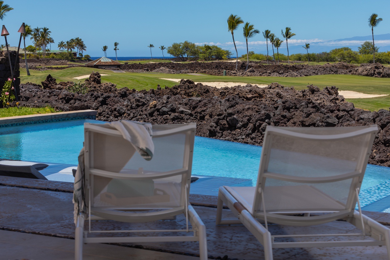 Waimea Vacation Rentals, 5BD Mauna Lani Lux Golf Estate (4) at One Ocean - Relax poolside with plentiful seating and picturesque views, ideal for enjoying a serene afternoon.