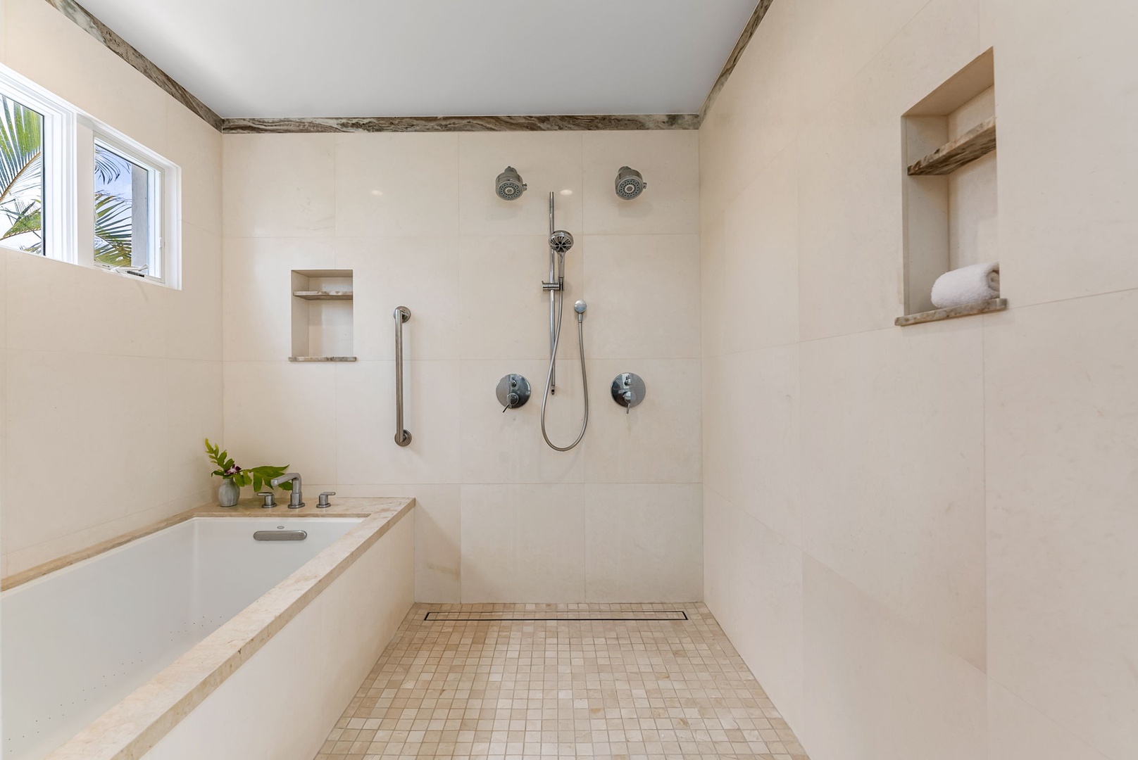 Kailua Vacation Rentals, Lanikai Sunrise Estate - Tile-accented walk-in shower and modern finishes offer both style and function in this elegant full bath.