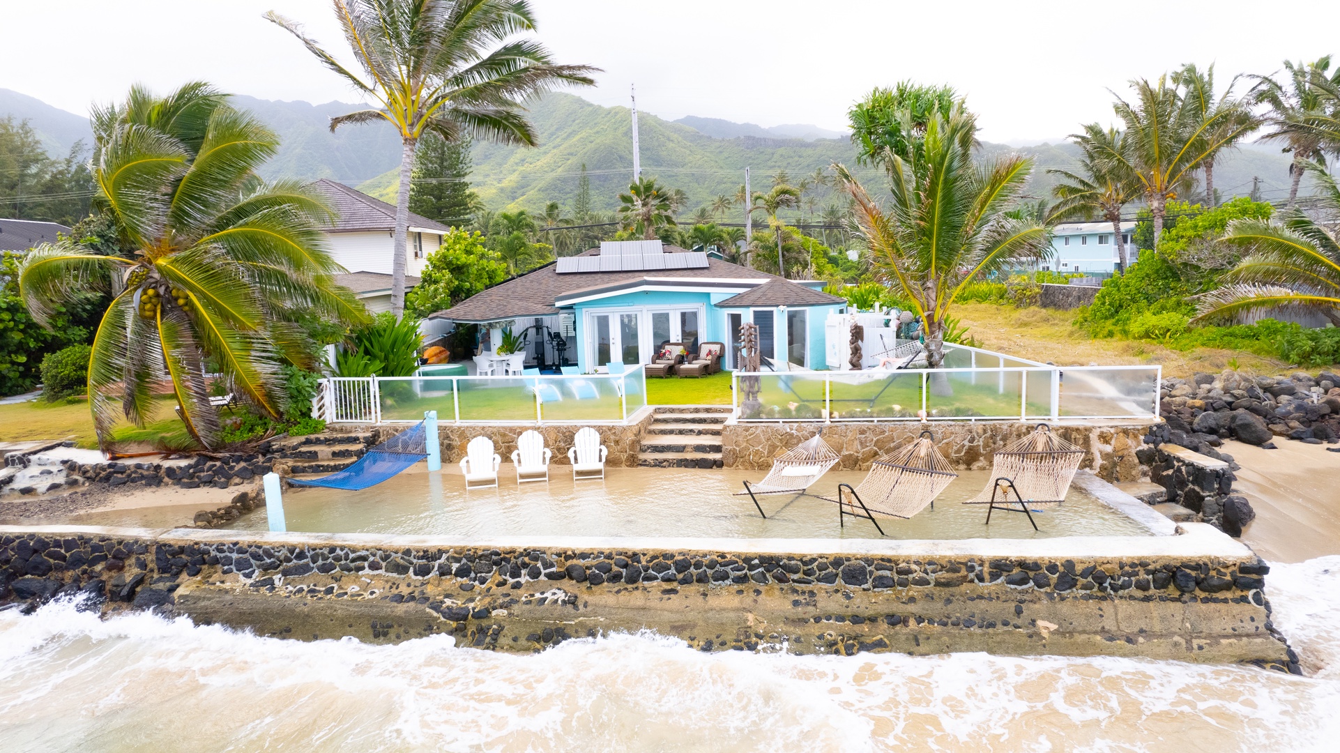 Hauula Vacation Rentals, Private Beach Paradise - Oceanfront property with private beach access and stunning mountain backdrop in tropical paradise.