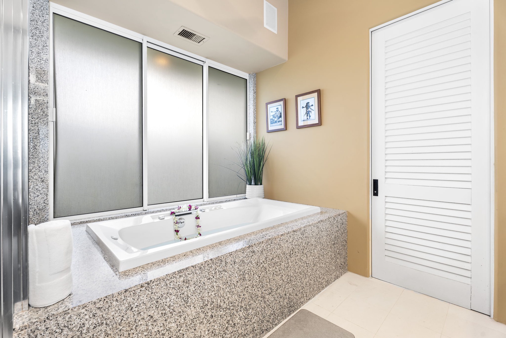 Kailua Kona Vacation Rentals, Hale Nai'a - Sink into pure luxury in your spa-like bathroom with a spacious soaking tub, elegant stone finishes, and soft lighting.