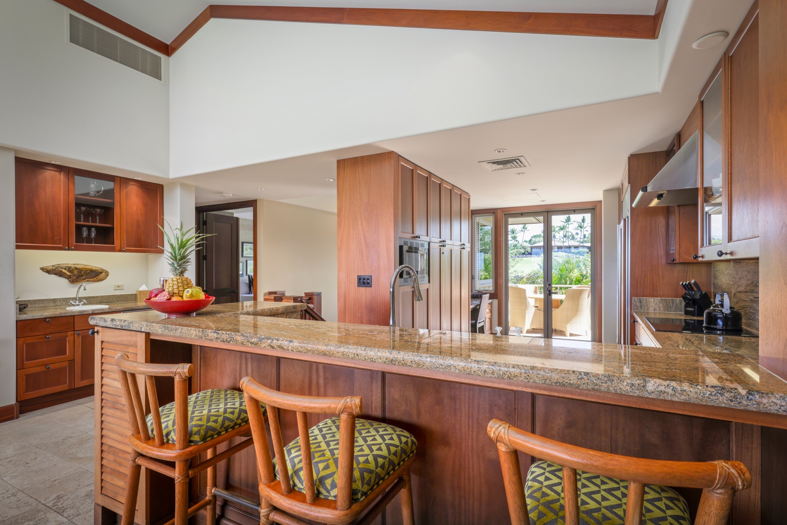 Kailua Kona Vacation Rentals, 3BD Ke Alaula Villa (210B) at Four Seasons Resort at Hualalai - Bar seating at the kitchen counter with the wet bar toward the left.