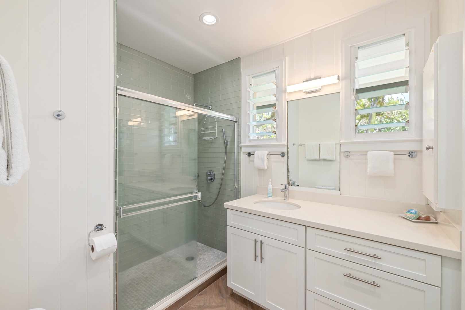 Kailua Vacation Rentals, Hale Moana Lanikai - Refresh and rejuvenate in this elegantly designed bathroom, featuring a spacious walk-in shower and a sleek, modern vanity