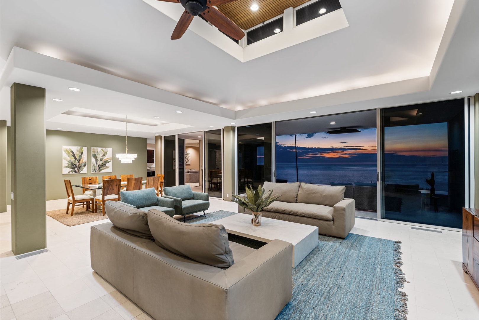Kailua Kona Vacation Rentals, Hale Nai'a - Unwind in your spacious living room where floor-to-ceiling windows frame breathtaking ocean views. Sink into plush seating as sunset colors paint the sky.
