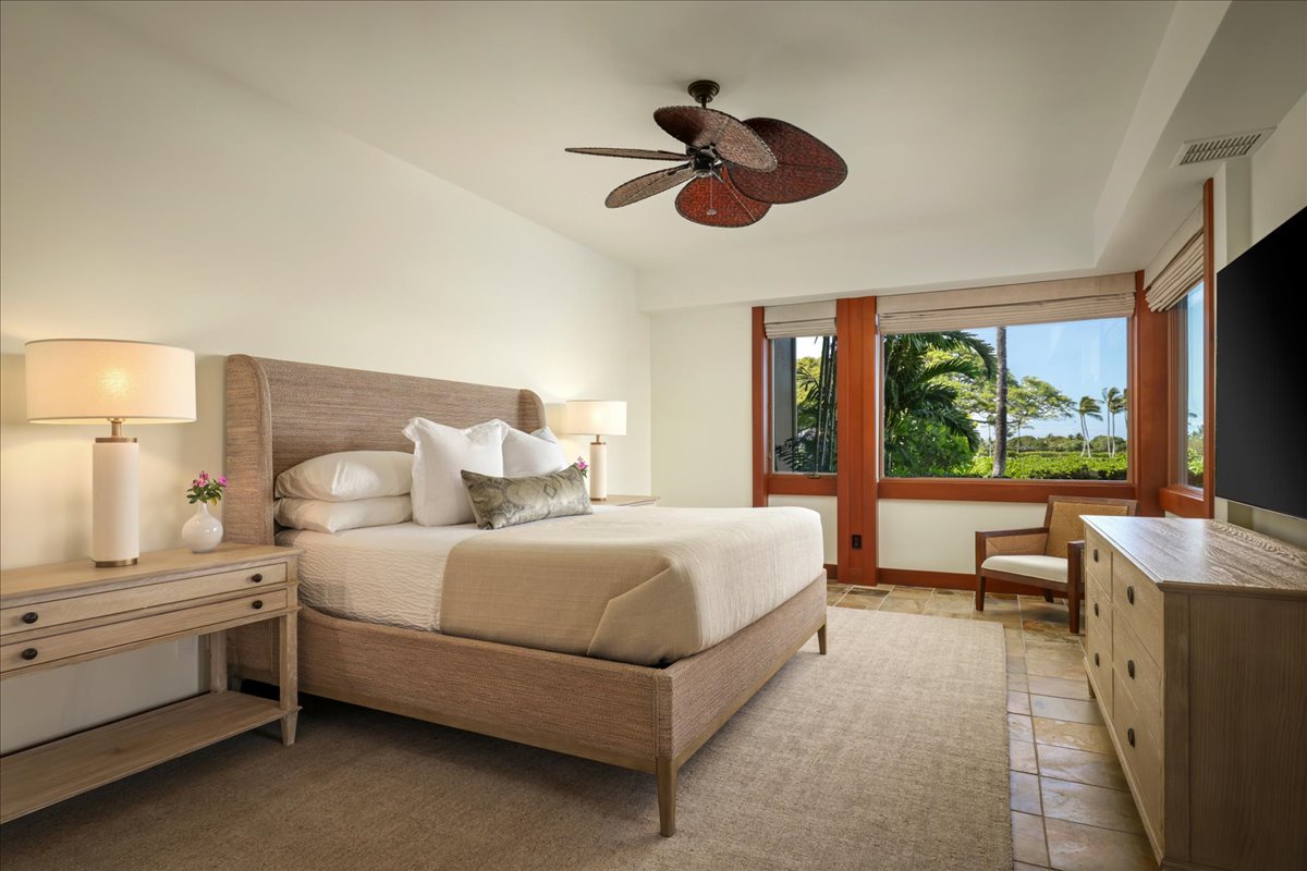 Kailua Kona Vacation Rentals, 2BD Fairways Villa (120C) at Four Seasons Resort at Hualalai - Primary bedroom suite with king bed, seating area, flatscreen television, walk-in closet.