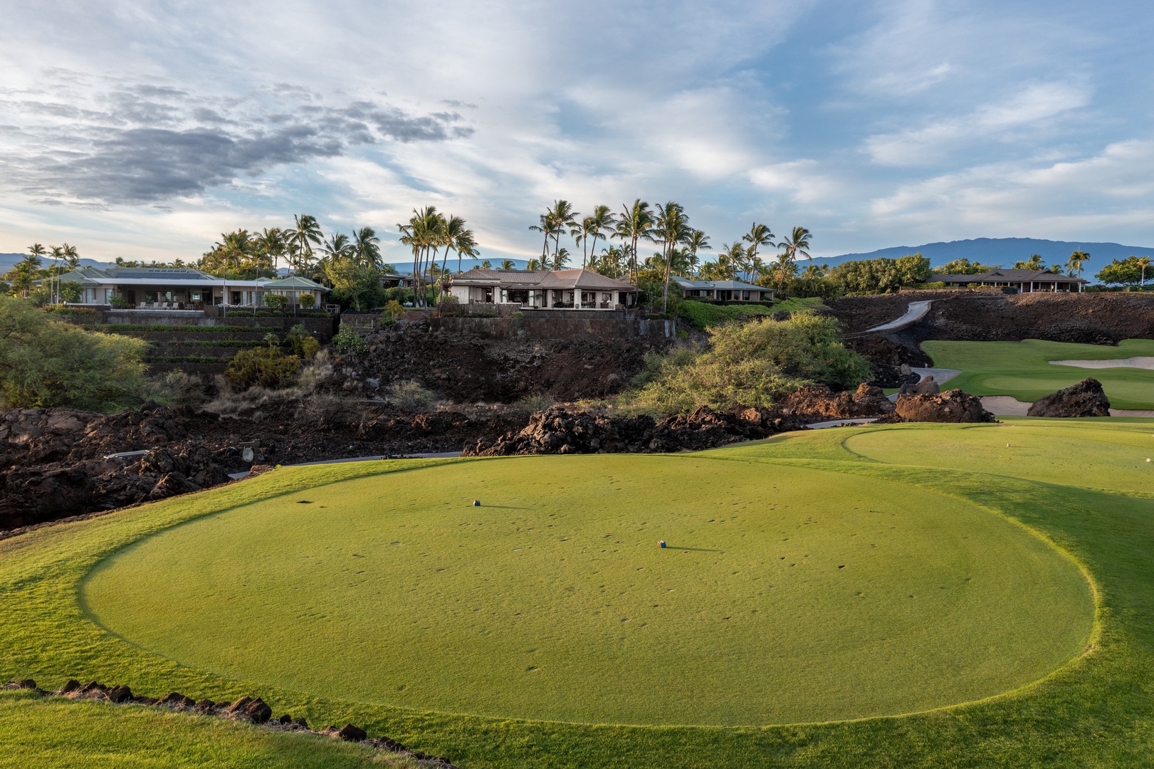 Kamuela Vacation Rentals, Champion Ridge 7 - Golfers take in a lush green challenge with the Pacific as a backdrop.