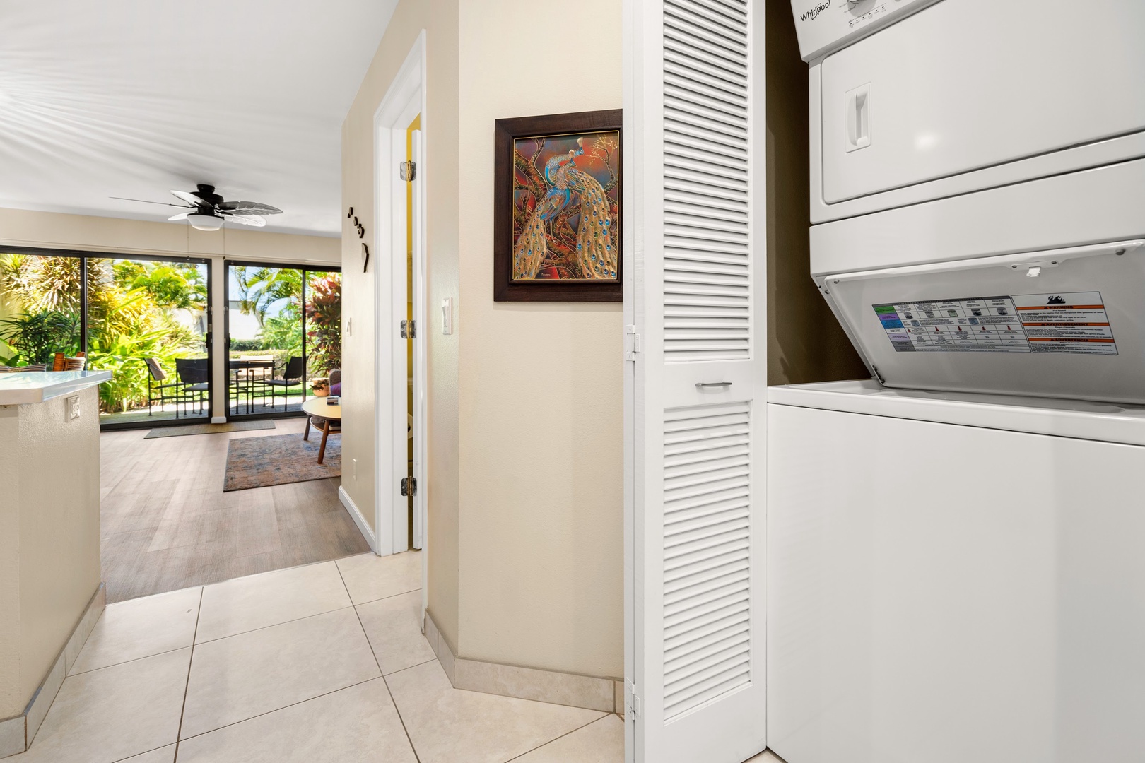 Kihei Vacation Rentals, Maui Kamaole E103 - A laundry closet tucks neatly into the hallway, just off the living room.