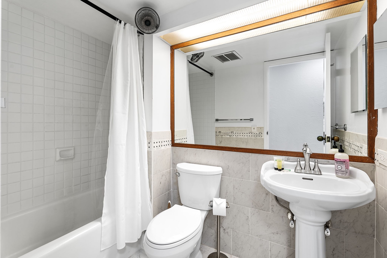 Kailua Kona Vacation Rentals, Kona Pacific C416 - Compact guest bathroom featuring a pedestal sink and clean design.