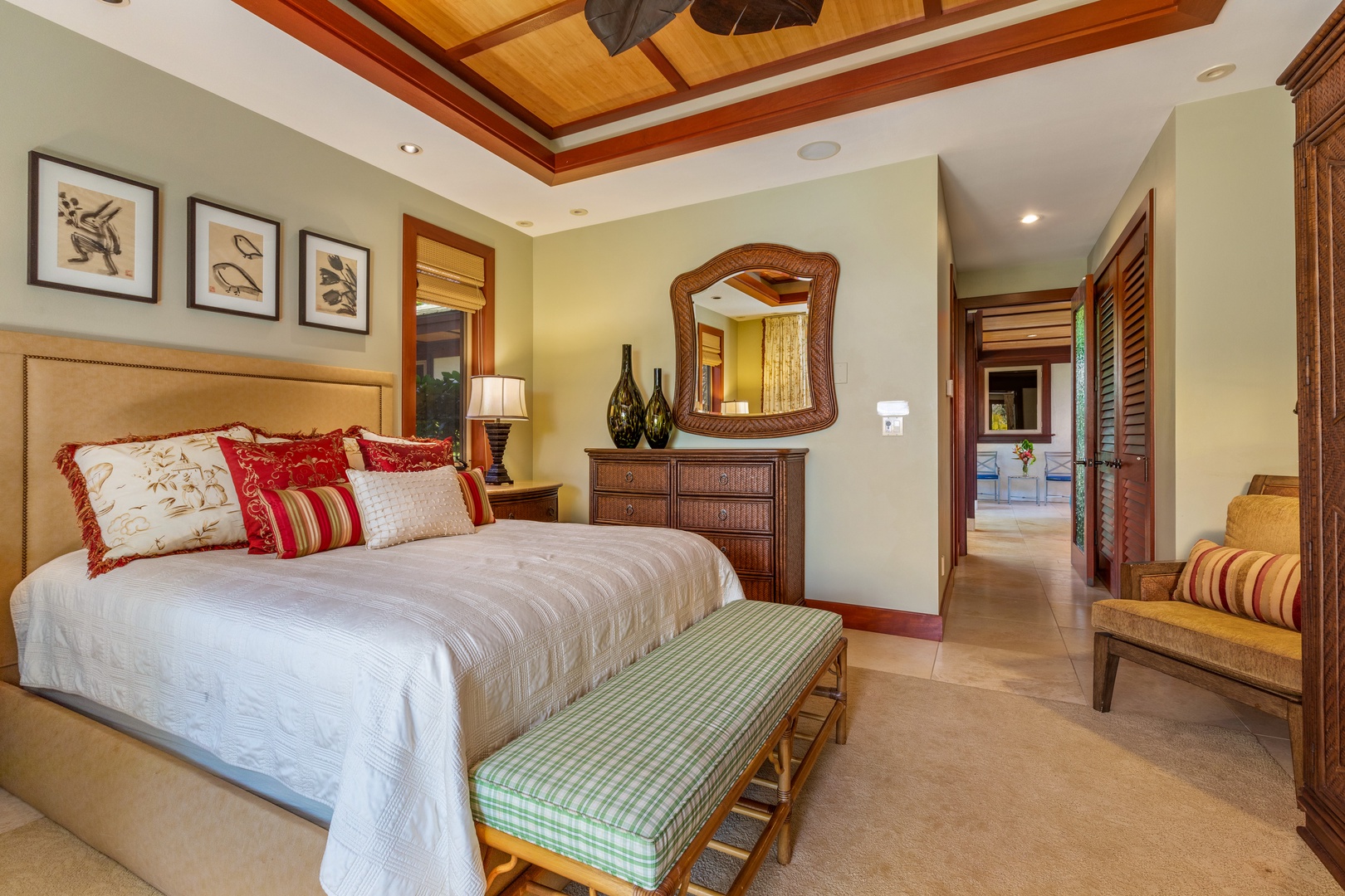 Kamuela Vacation Rentals, Champion Ridge Home - This elegant guest bedroom features a king bed, tropical accents, and a private ensuite bath for a restful retreat.