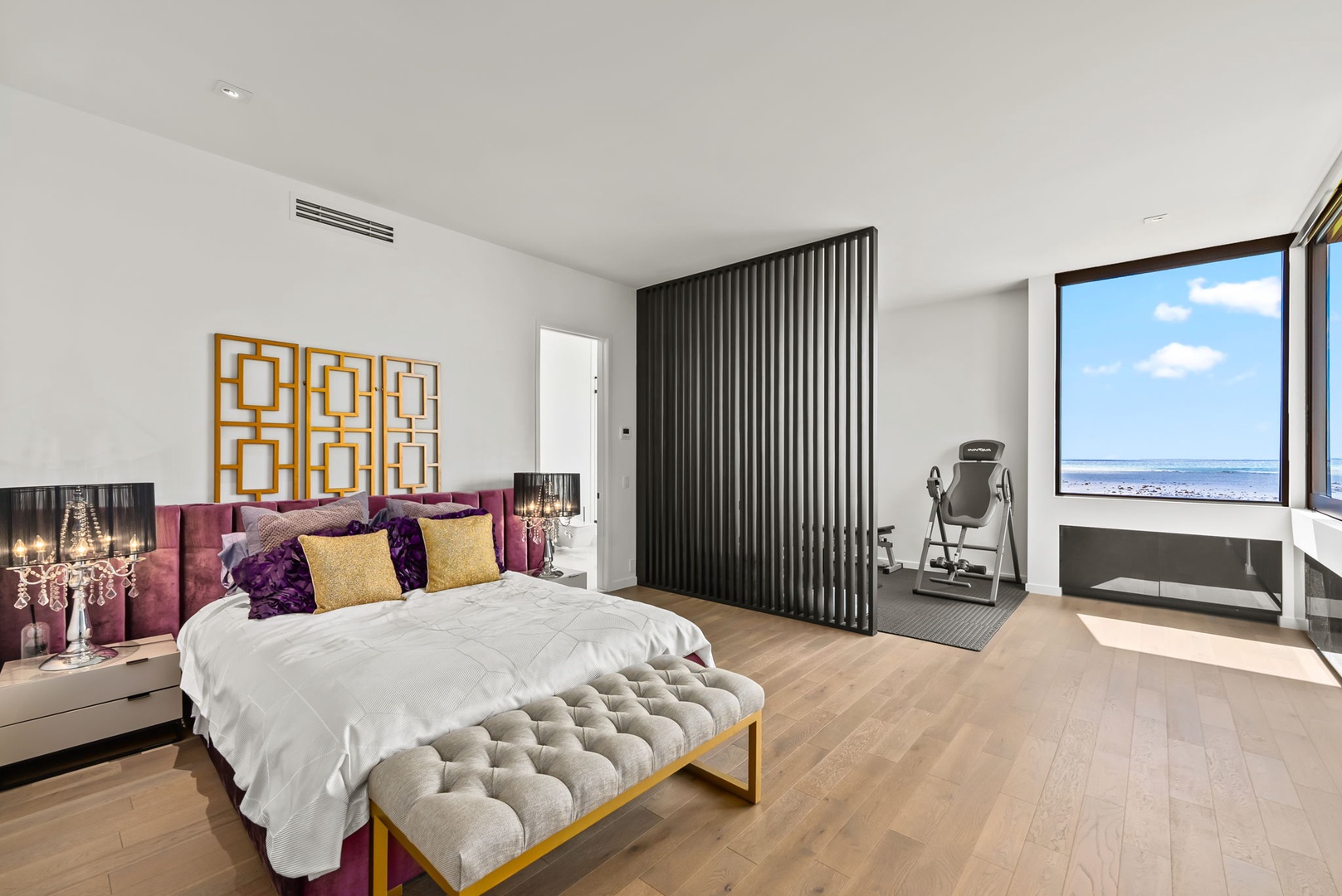 Honolulu Vacation Rentals, Ocean Villa Emilie - A stylish guest suite with textured wall accents and workspace, ideal for blending work and play during your stay.