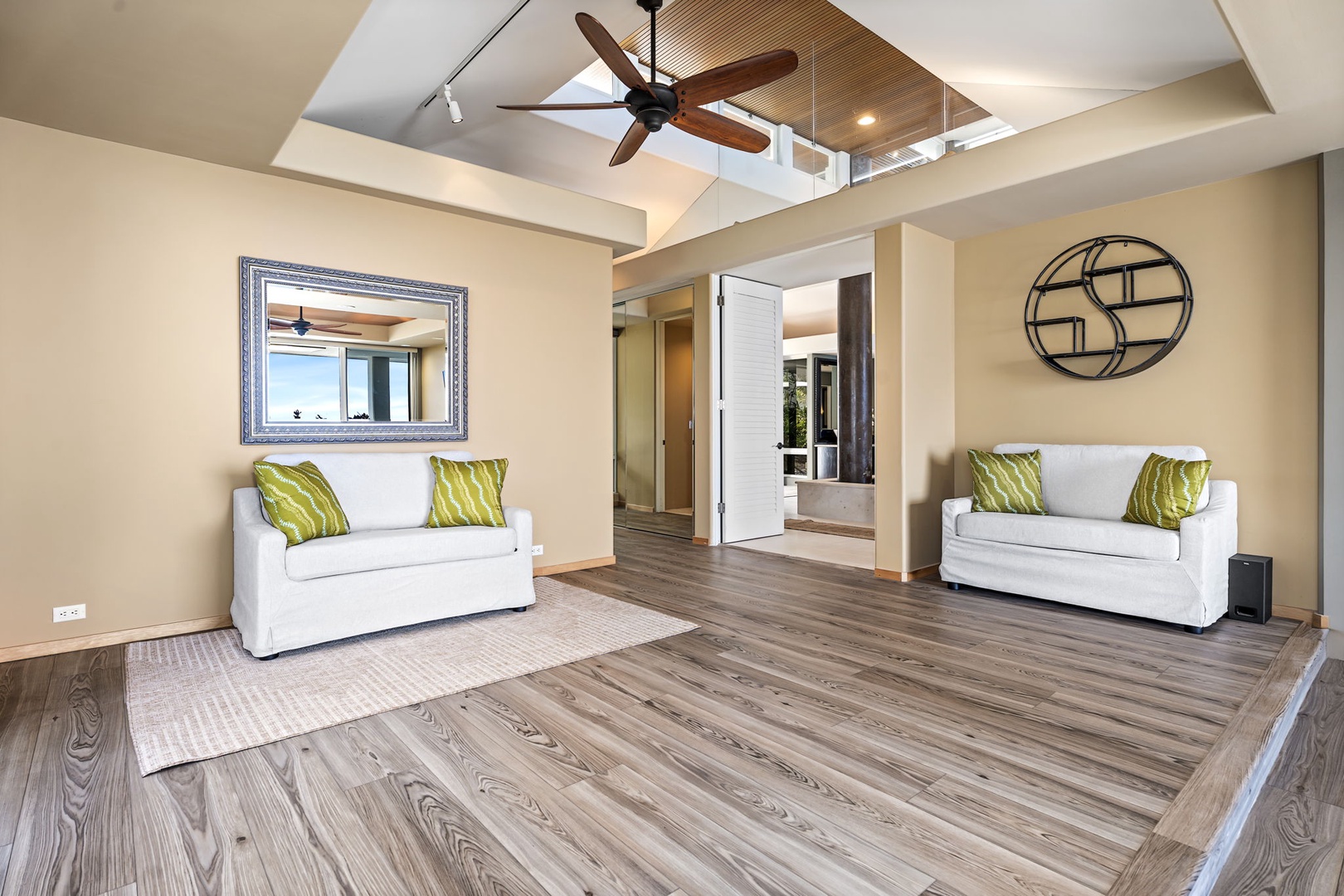 Kailua Kona Vacation Rentals, Hale Nai'a - Unwind in your spacious living area with soaring ceilings, rich wood floors, and comfortable seating perfect for relaxation.