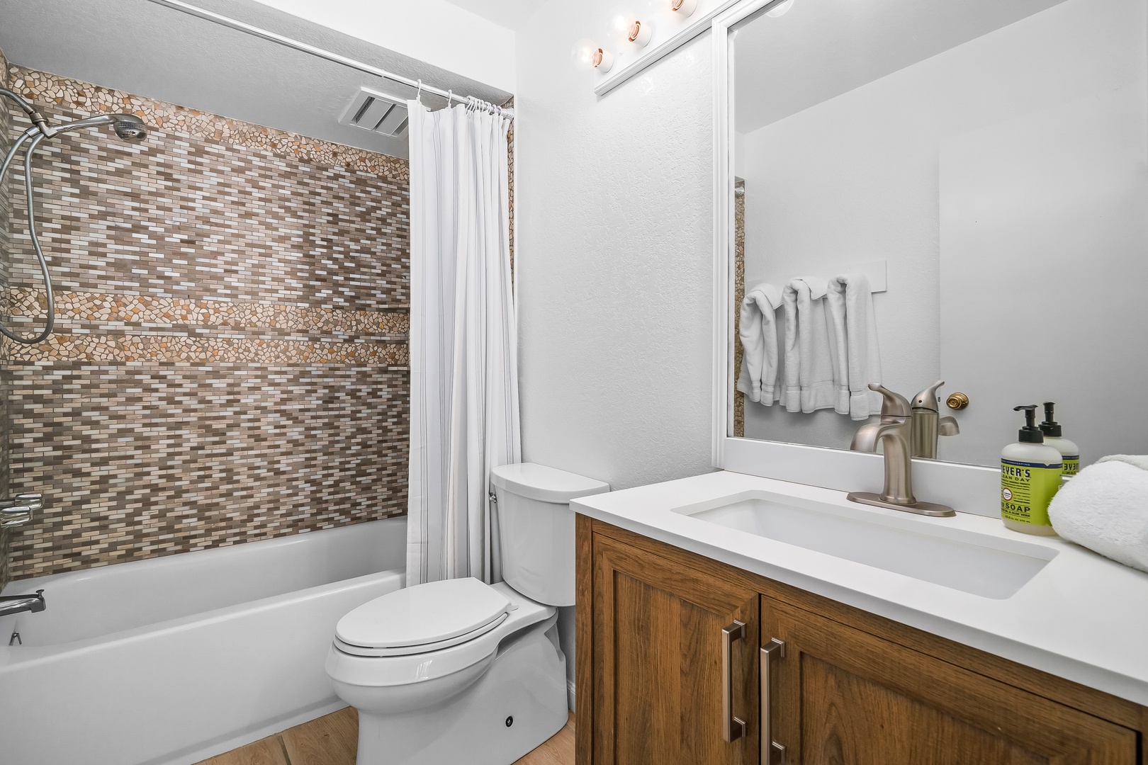Princeville Vacation Rentals, Mauna Kai 7B - Rinse the beach off in the shower before the evening starts.