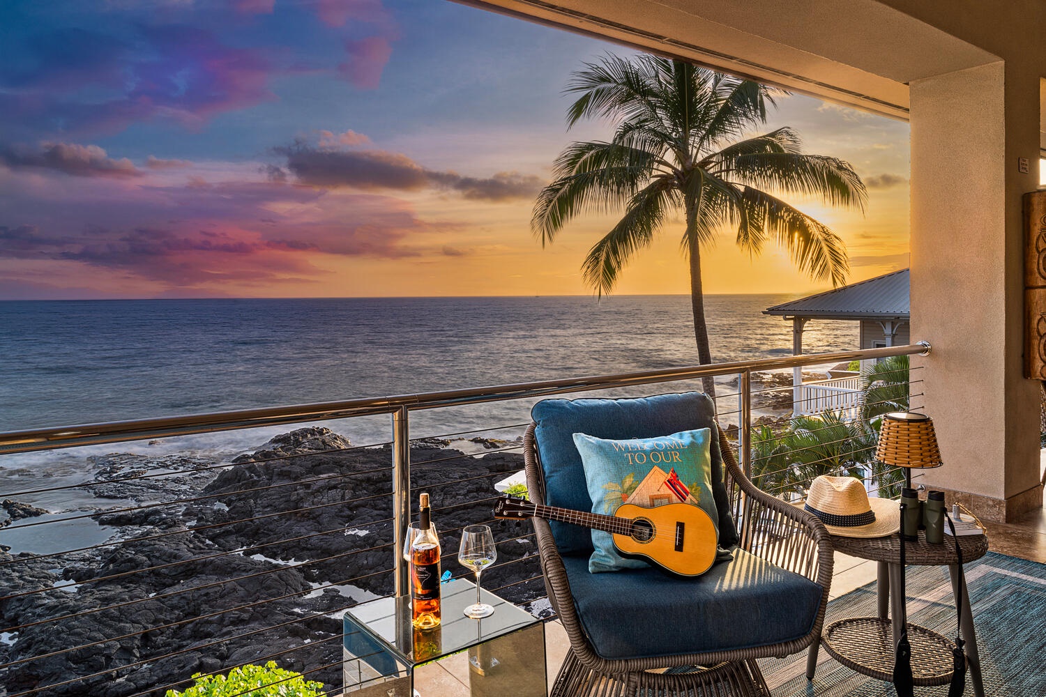 Kailua Kona Vacation Rentals, Kailani Vista - Watch fiery Kona colors paint the sky as you settle into the ocean-front wicker chair—ukulele, sea breeze, and the crash of waves included.