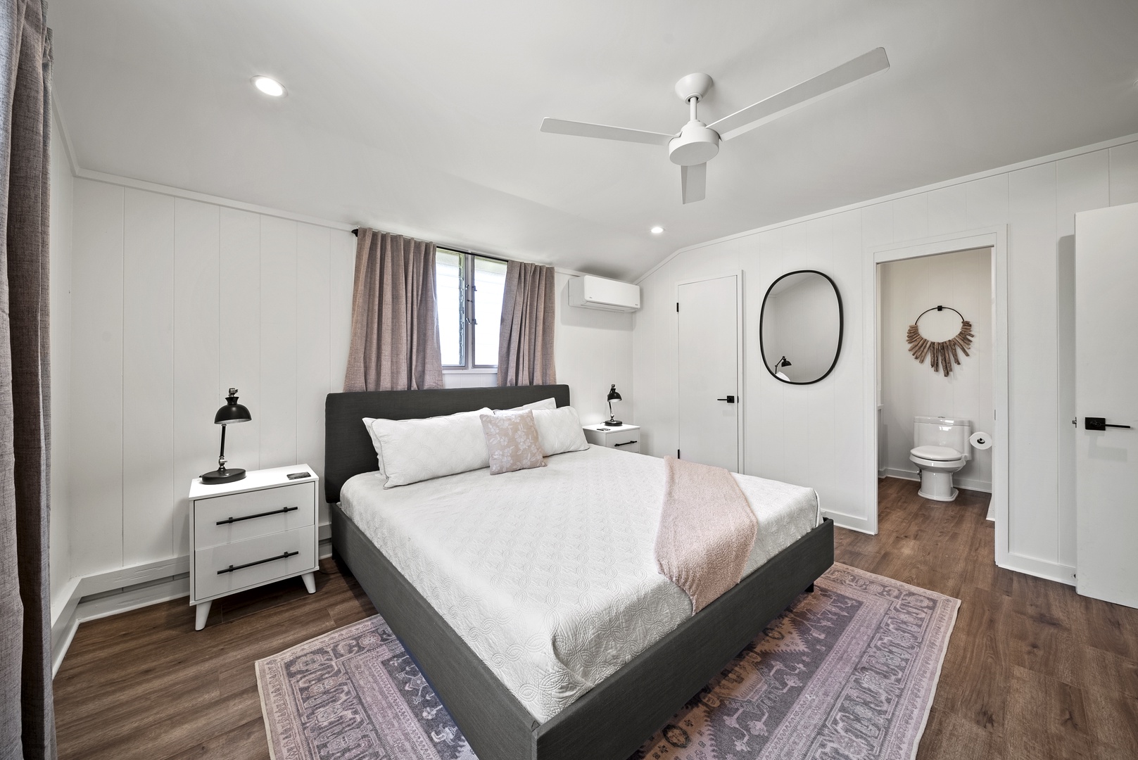 Honolulu Vacation Rentals, Honolulu Beachfront Retreat - Chic guest suite featuring a king-sized bed, soft neutral tones, and thoughtful finishes for restful nights.