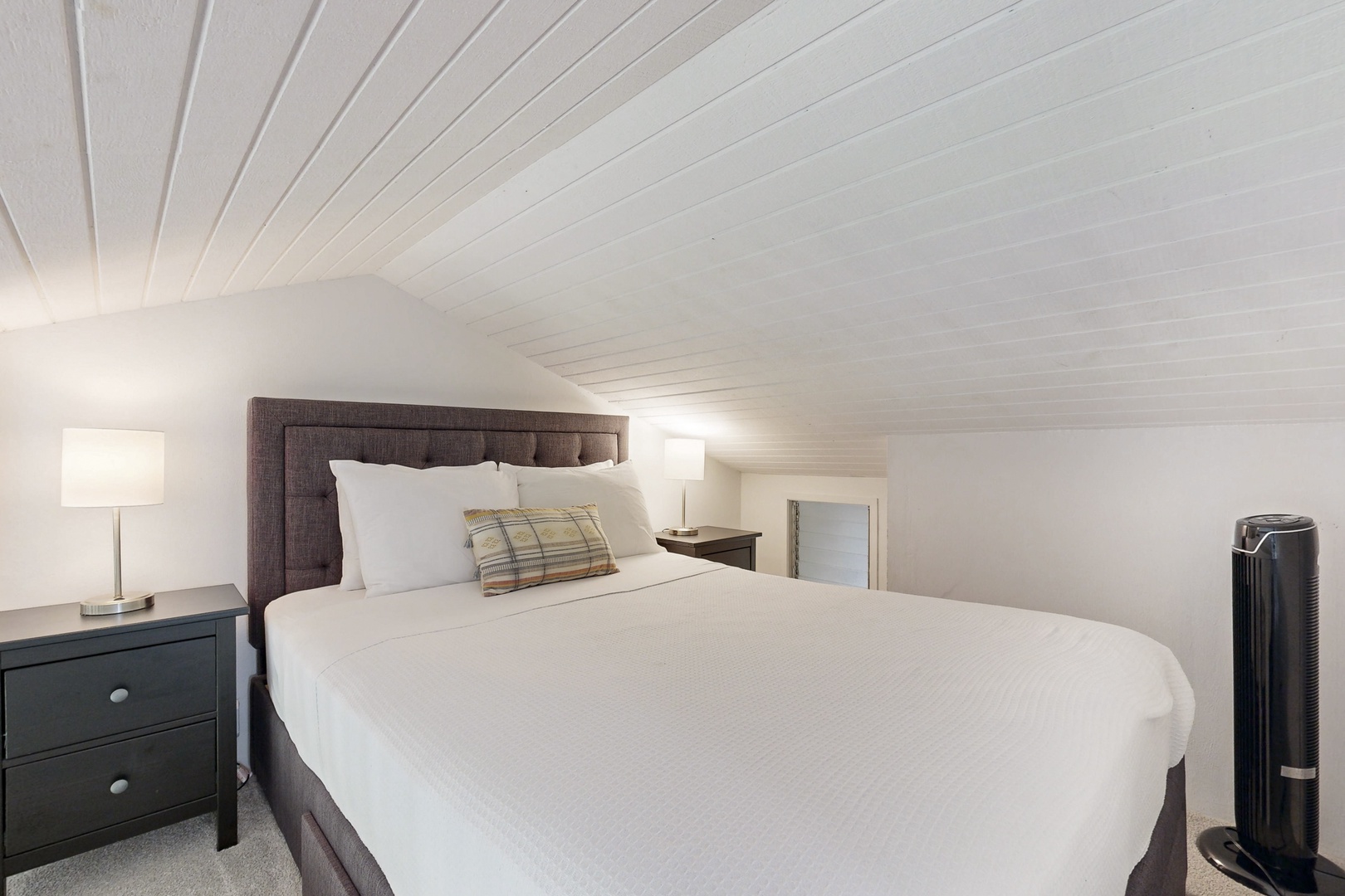 Kahuku Vacation Rentals, Kuilima Estates West #132 - Cozy loft sleeping area with warm lighting.