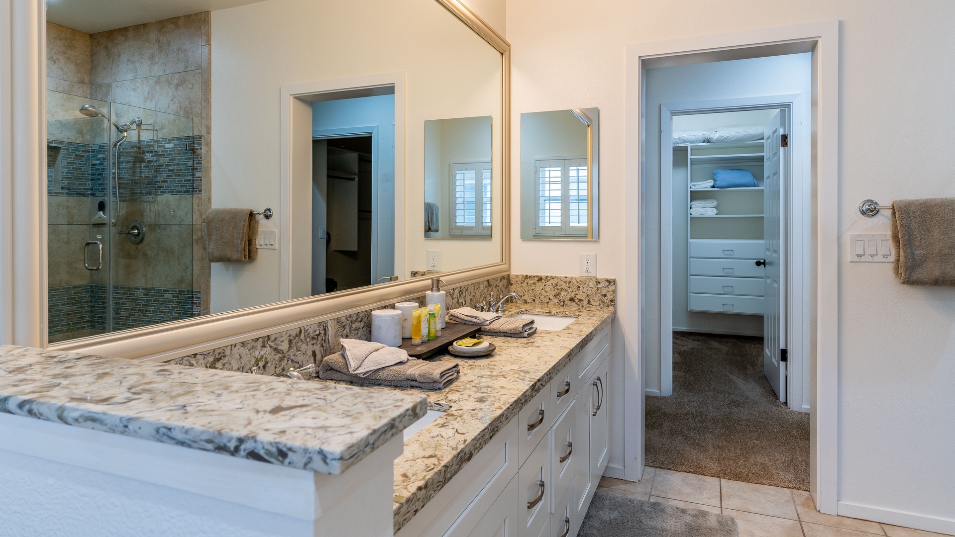 Kapolei Vacation Rentals, Coconut Plantation 1158-1 - The primary guest bathroom upstairs with a double vanity and walk-in closet.