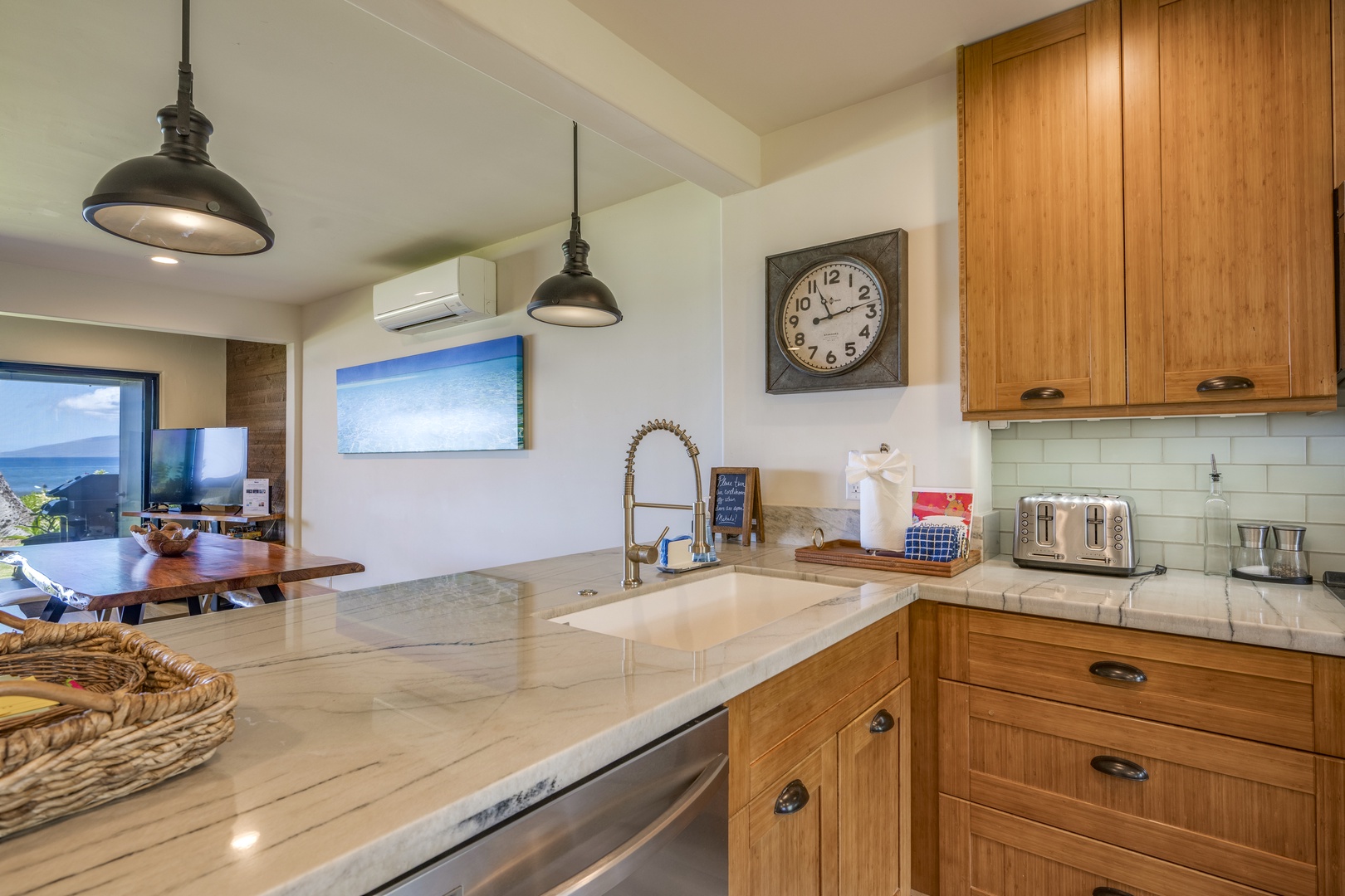Lahaina Vacation Rentals, Puamana 240-3 - Enjoy preparing meals in this bright and airy kitchen, complete with stainless steel appliances and ample counter space.