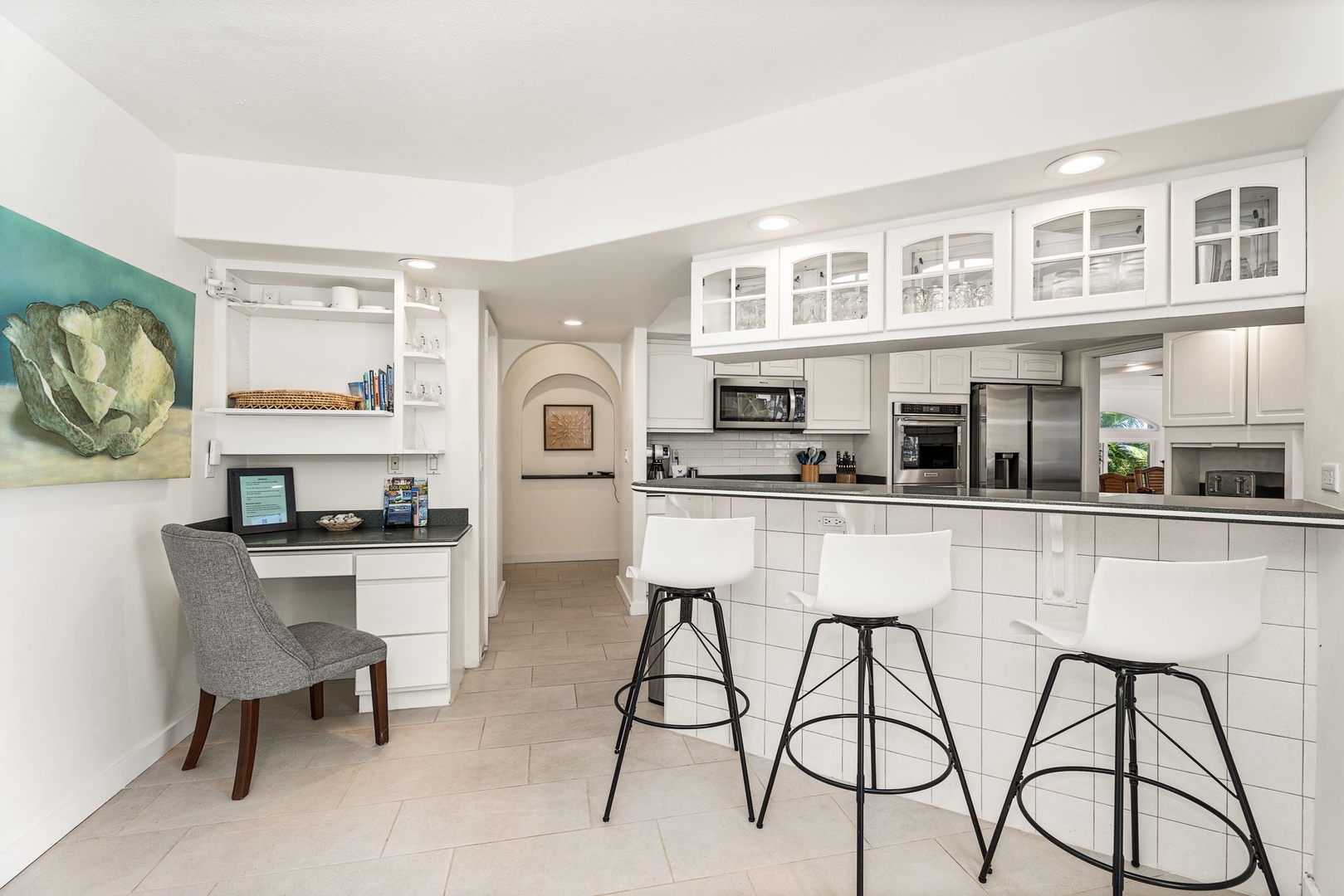 Kailua-Kona Vacation Rentals, Honu Hale - Modern appliances, a breakfast bar, and a cozy work nook—perfect for vacation meal prep and planning.