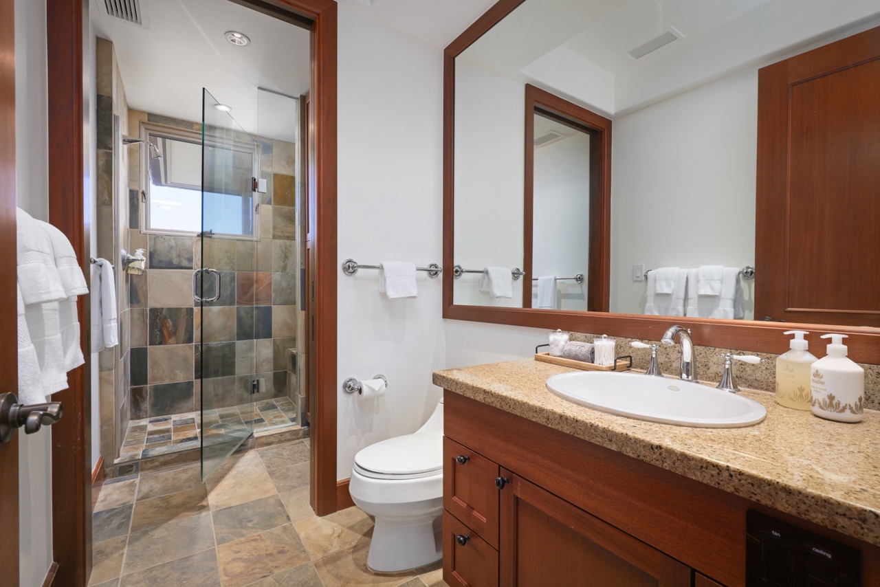 Kailua Kona Vacation Rentals, 3BD Ka'Ulu Villa (109A) at Hualalai Resort - Full bathroom adjacent to the third bedroom with a walk-in shower.