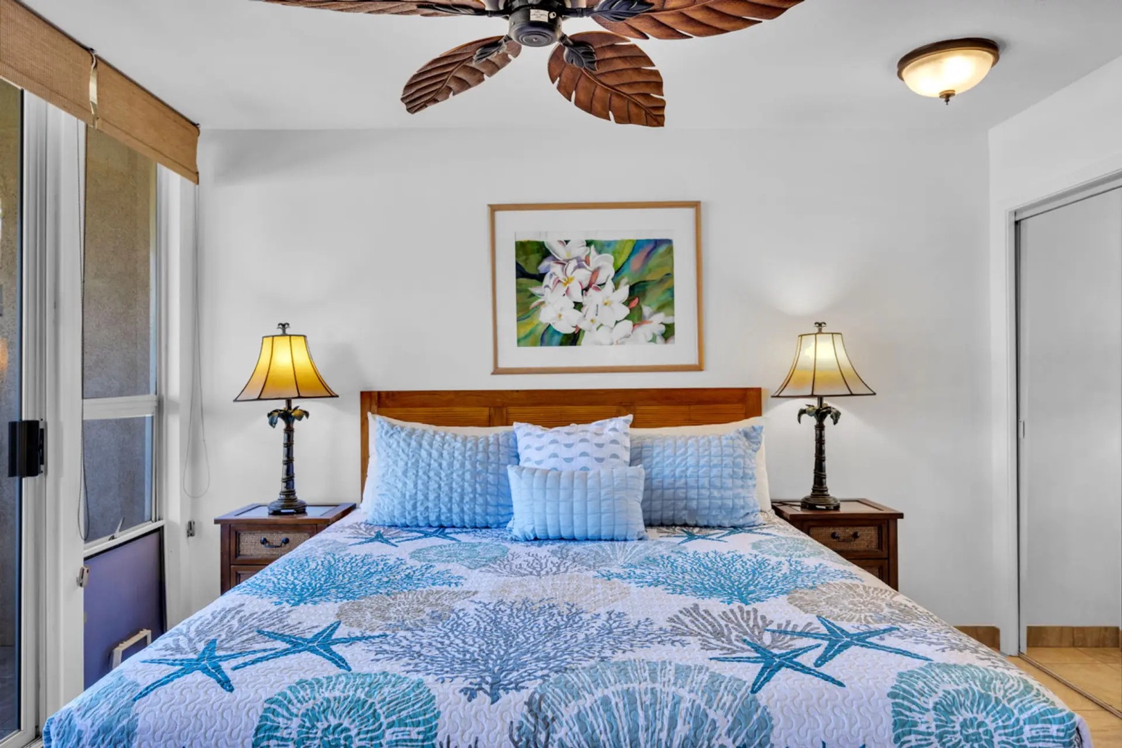 Kihei Vacation Rentals, Maui Banyan H306 - Turn in early under the plumeria print, in the kind of room that makes you sleep late.