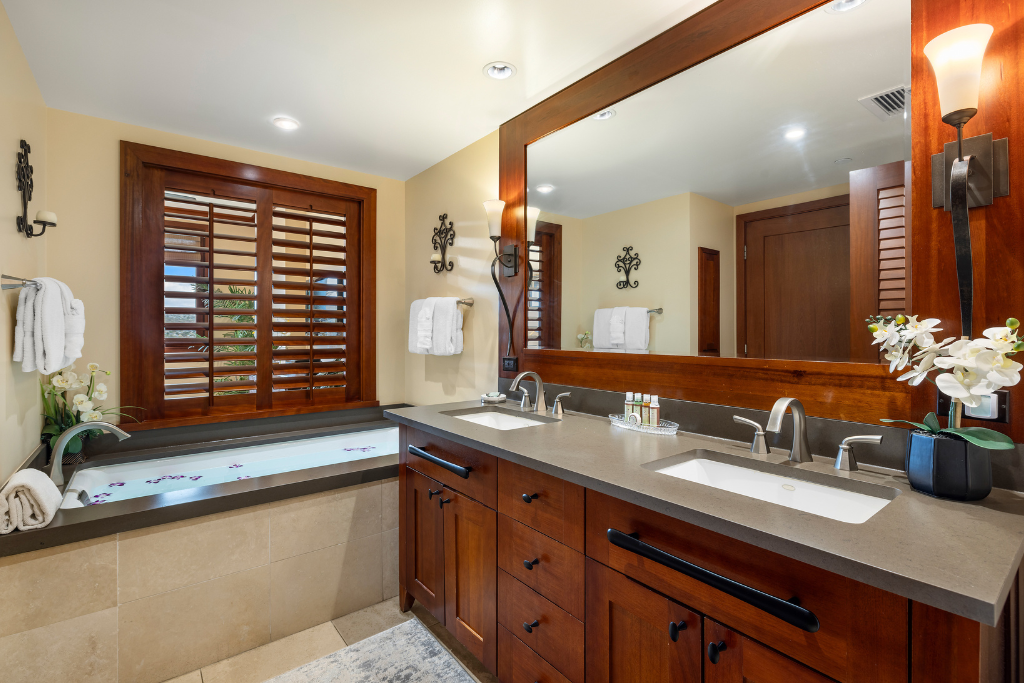 Kapolei Vacation Rentals, Ko Olina Beach Villas O1404 - Primary bathroom with soaking tub and walk-in shower